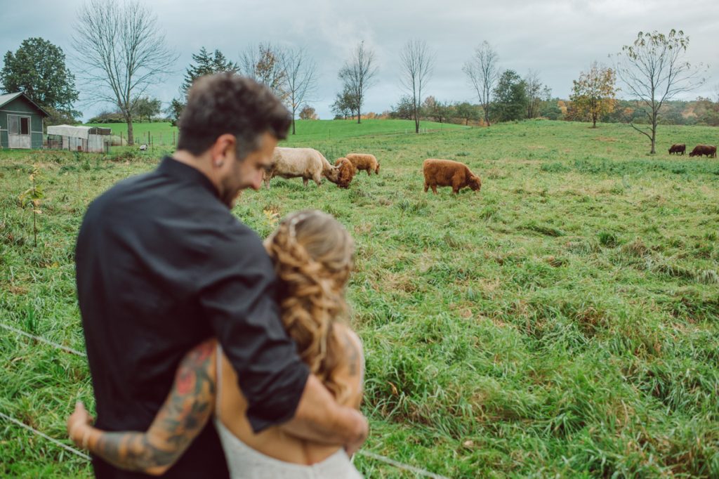 The Farm at Glenwood Mountain located in Sussex, NJ right by Mountain Creek Resort, this unique farm wedding venue was on my bucket list and I had the chance to photograph a wedding here with the best couple! Cristina and Nick, rock'n roll loving die hard fan of Marvel Studio duo celebrated their love and becoming one union at The Farm at Glenwood Mountain with fluffy cows in their backdrop. Cristina and Nick's love for each other is so real and true brought tears and smile on my eye and face the entire day. Cristina and Nick's The Farm and Glenwood Mountain wedding photographed by Hudson Valley, Catskills, NYC and NJ, Fun Wedding and Intimate Elopement Photographer | Hey Karis.