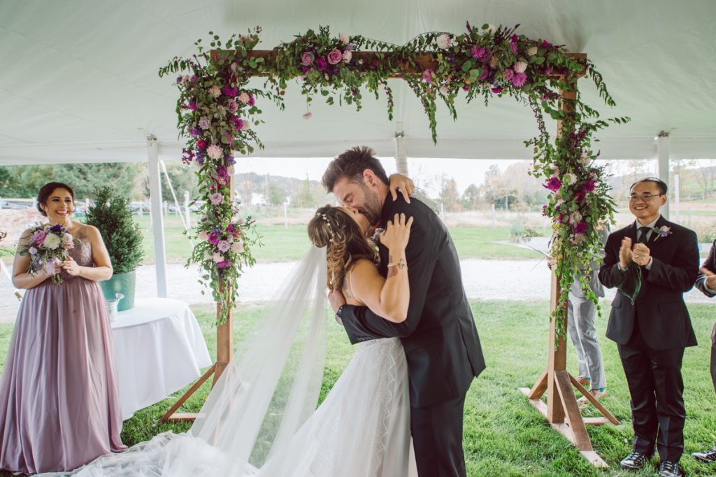 The Farm at Glenwood Mountain located in Sussex, NJ right by Mountain Creek Resort, this unique farm wedding venue was on my bucket list and I had the chance to photograph a wedding here with the best couple! Cristina and Nick, rock'n roll loving die hard fan of Marvel Studio duo celebrated their love and becoming one union at The Farm at Glenwood Mountain with fluffy cows in their backdrop. Cristina and Nick's love for each other is so real and true brought tears and smile on my eye and face the entire day. Cristina and Nick's The Farm and Glenwood Mountain wedding photographed by Hudson Valley, Catskills, NYC and NJ, Fun Wedding and Intimate Elopement Photographer | Hey Karis.