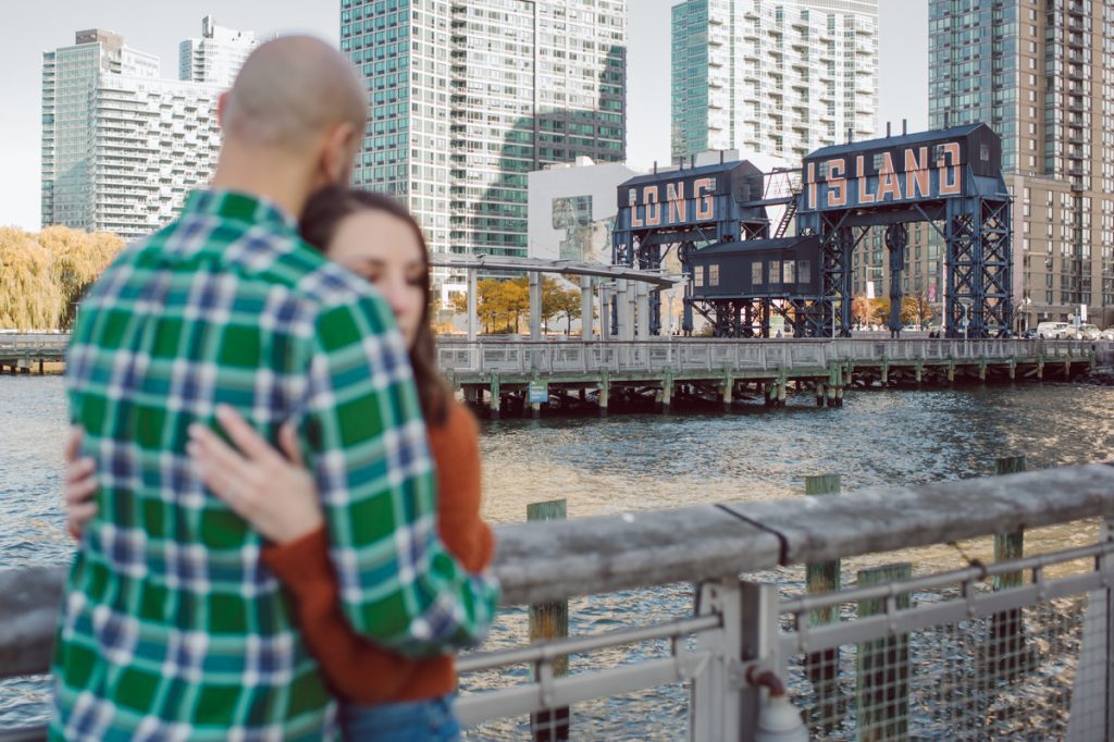 The fun I had meeting Wilson, Melanie and Calvin's Golden Doodle pup I had the pleasure of meeting for their engagement session at Gantry Plaza State Park LIC. Melanie and Calvin lives right by the Gantry Plaza State Park so naturally we chose to meet here for their engagement session, plus we had to make it easy for their fur baby Wilson to join. Wilson of course stole all my attention for the first half of the engagement session then Wilson was walked by Melanie and Calvin's friend while we wandered off the explore other parts of Gantry Plaza State Park. Melanie and Calvin's Fall engagement session at Gantry Plaza State Park LIC joined by their golden doodle Wilson photographed by Hudson Valley, Catskills, NYC and NJ, Fun Weddings and Intimate Elopements Photographer | Hey Karis.