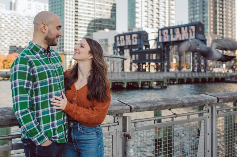 The fun I had meeting Wilson, Melanie and Calvin's Golden Doodle pup I had the pleasure of meeting for their engagement session at Gantry Plaza State Park LIC. Melanie and Calvin lives right by the Gantry Plaza State Park so naturally we chose to meet here for their engagement session, plus we had to make it easy for their fur baby Wilson to join. Wilson of course stole all my attention for the first half of the engagement session then Wilson was walked by Melanie and Calvin's friend while we wandered off the explore other parts of Gantry Plaza State Park. Melanie and Calvin's Fall engagement session at Gantry Plaza State Park LIC joined by their golden doodle Wilson photographed by Hudson Valley, Catskills, NYC and NJ, Fun Weddings and Intimate Elopements Photographer | Hey Karis.