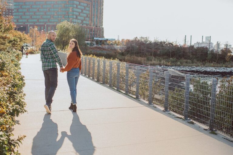 The fun I had meeting Wilson, Melanie and Calvin's Golden Doodle pup I had the pleasure of meeting for their engagement session at Gantry Plaza State Park LIC. Melanie and Calvin lives right by the Gantry Plaza State Park so naturally we chose to meet here for their engagement session, plus we had to make it easy for their fur baby Wilson to join. Wilson of course stole all my attention for the first half of the engagement session then Wilson was walked by Melanie and Calvin's friend while we wandered off the explore other parts of Gantry Plaza State Park. Melanie and Calvin's Fall engagement session at Gantry Plaza State Park LIC joined by their golden doodle Wilson photographed by Hudson Valley, Catskills, NYC and NJ, Fun Weddings and Intimate Elopements Photographer | Hey Karis.