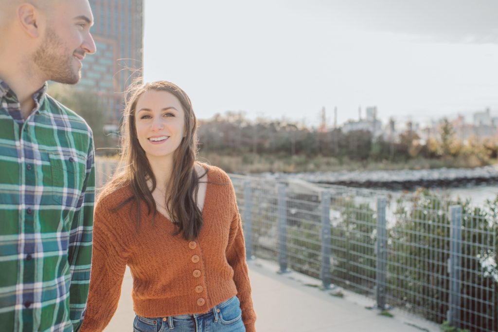 The fun I had meeting Wilson, Melanie and Calvin's Golden Doodle pup I had the pleasure of meeting for their engagement session at Gantry Plaza State Park LIC. Melanie and Calvin lives right by the Gantry Plaza State Park so naturally we chose to meet here for their engagement session, plus we had to make it easy for their fur baby Wilson to join. Wilson of course stole all my attention for the first half of the engagement session then Wilson was walked by Melanie and Calvin's friend while we wandered off the explore other parts of Gantry Plaza State Park. Melanie and Calvin's Fall engagement session at Gantry Plaza State Park LIC joined by their golden doodle Wilson photographed by Hudson Valley, Catskills, NYC and NJ, Fun Weddings and Intimate Elopements Photographer | Hey Karis.