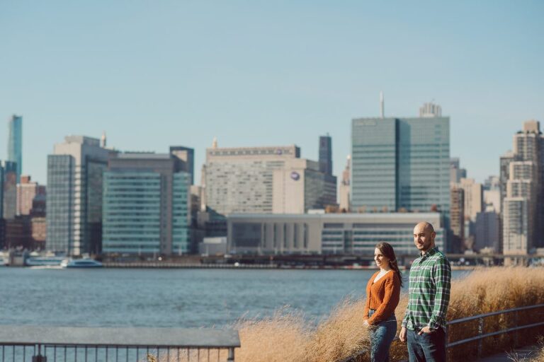 The fun I had meeting Wilson, Melanie and Calvin's Golden Doodle pup I had the pleasure of meeting for their engagement session at Gantry Plaza State Park LIC. Melanie and Calvin lives right by the Gantry Plaza State Park so naturally we chose to meet here for their engagement session, plus we had to make it easy for their fur baby Wilson to join. Wilson of course stole all my attention for the first half of the engagement session then Wilson was walked by Melanie and Calvin's friend while we wandered off the explore other parts of Gantry Plaza State Park. Melanie and Calvin's Fall engagement session at Gantry Plaza State Park LIC joined by their golden doodle Wilson photographed by Hudson Valley, Catskills, NYC and NJ, Fun Weddings and Intimate Elopements Photographer | Hey Karis.