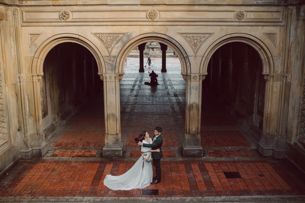 Raymond reached out to me about a month ago regarding his elopement plans at Central Park, NY. Specifically on the Bow Bridge Central Park, NY. His original elopement plan only included his finace and himself plus the officiant but as all wedding plans go they ended up adding their parents and family to the celebration. Rose and Raymond's Central Park NY elopement started bit rainy and gloomy but rain stopped right on time for Rose and Raymond's Bow Bridge elopement. Then we walked around Bethesda Fountain and Bethesda Arcade for some wedding portraits. Rose and Raymond braved the chilly almost freezing NYC weather during the portrait time and we were able to get some amazing photos at Central Park. Rose and Raymond's Central Park NY Elopement photographed by Hudson Valley, Catskills, NYC and NJ, Fun Weddings and Intimate Elopements Photographer | Hey Karis.