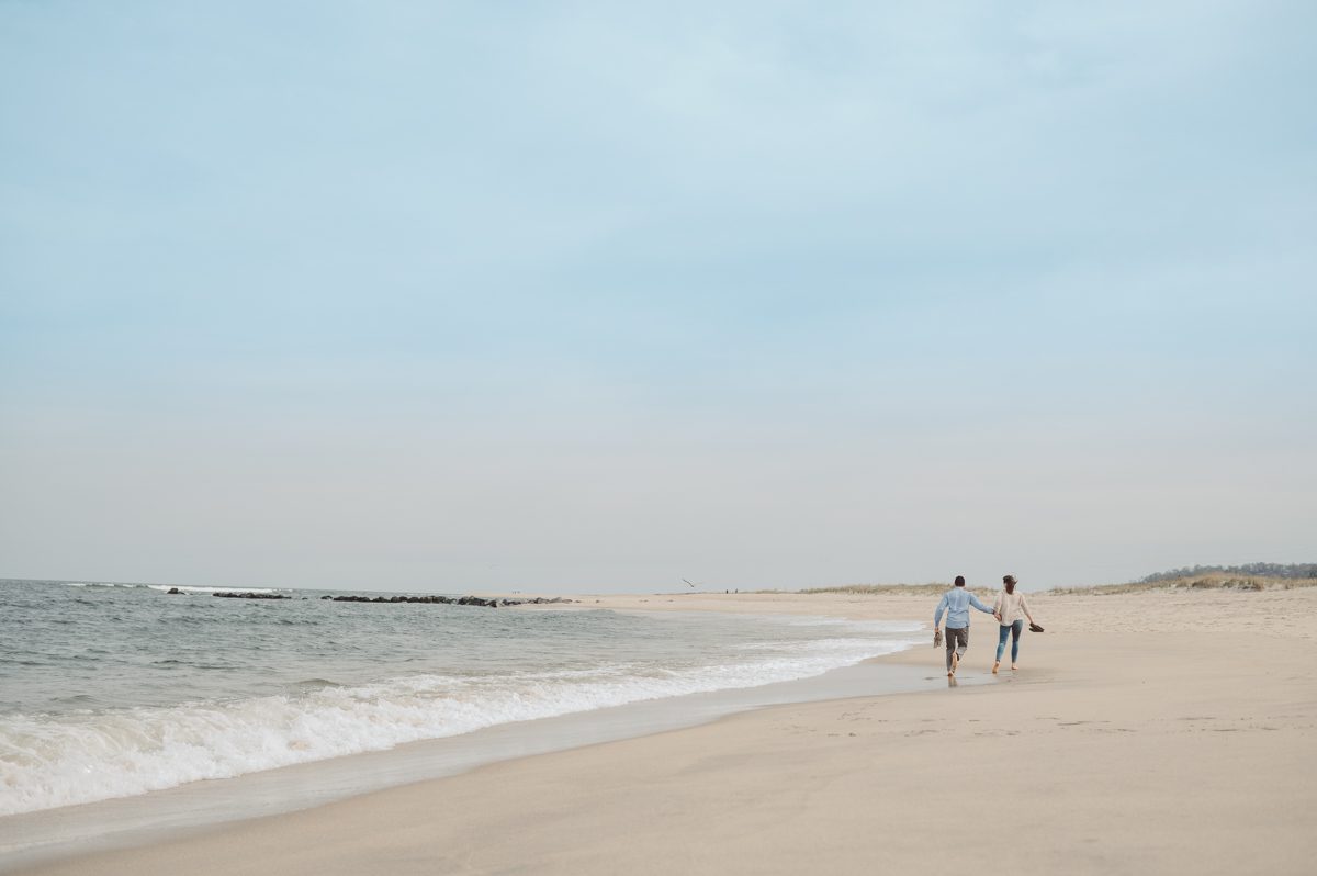 Perfect day would look like this, I said admiring the beach, the landscape and the amazing colors that I was looking out in the horizon. Sky, sea, sand looked as if they were painted in pastel blues, beige, and white. Wind moved, hair dancing, it was going to be fabulous engagement session with Becca and Dan! I fell in love with Sandy Hook Beach, and loved my awesome clients that follows all my weird, silly and sometime awkward directions/posing. My favorite out of Becca and Dan's Sandy Hook engagement session is the one that I got inspired by Wes Anderson's movie "Moonlight Kingdom"! Becca and Dan's Sandy Hook Beach NJ engagement by Karis. Hey Karis is Hudson Valley, Garrison NY and NJ, Fun Weddings and Intimate Elopements Photographer.