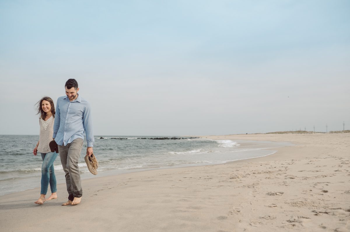 Perfect day would look like this, I said admiring the beach, the landscape and the amazing colors that I was looking out in the horizon. Sky, sea, sand looked as if they were painted in pastel blues, beige, and white. Wind moved, hair dancing, it was going to be fabulous engagement session with Becca and Dan! I fell in love with Sandy Hook Beach, and loved my awesome clients that follows all my weird, silly and sometime awkward directions/posing. My favorite out of Becca and Dan's Sandy Hook engagement session is the one that I got inspired by Wes Anderson's movie "Moonlight Kingdom"! Becca and Dan's Sandy Hook Beach NJ engagement by Karis. Hey Karis is Hudson Valley, Garrison NY and NJ, Fun Weddings and Intimate Elopements Photographer.