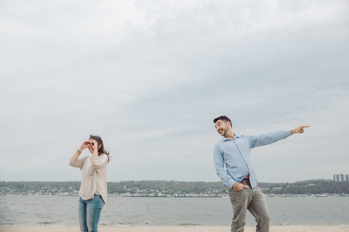 Perfect day would look like this, I said admiring the beach, the landscape and the amazing colors that I was looking out in the horizon. Sky, sea, sand looked as if they were painted in pastel blues, beige, and white. Wind moved, hair dancing, it was going to be fabulous engagement session with Becca and Dan! I fell in love with Sandy Hook Beach, and loved my awesome clients that follows all my weird, silly and sometime awkward directions/posing. My favorite out of Becca and Dan's Sandy Hook engagement session is the one that I got inspired by Wes Anderson's movie "Moonlight Kingdom"! Becca and Dan's Sandy Hook Beach NJ engagement by Karis. Hey Karis is Hudson Valley, Garrison NY and NJ, Fun Weddings and Intimate Elopements Photographer.