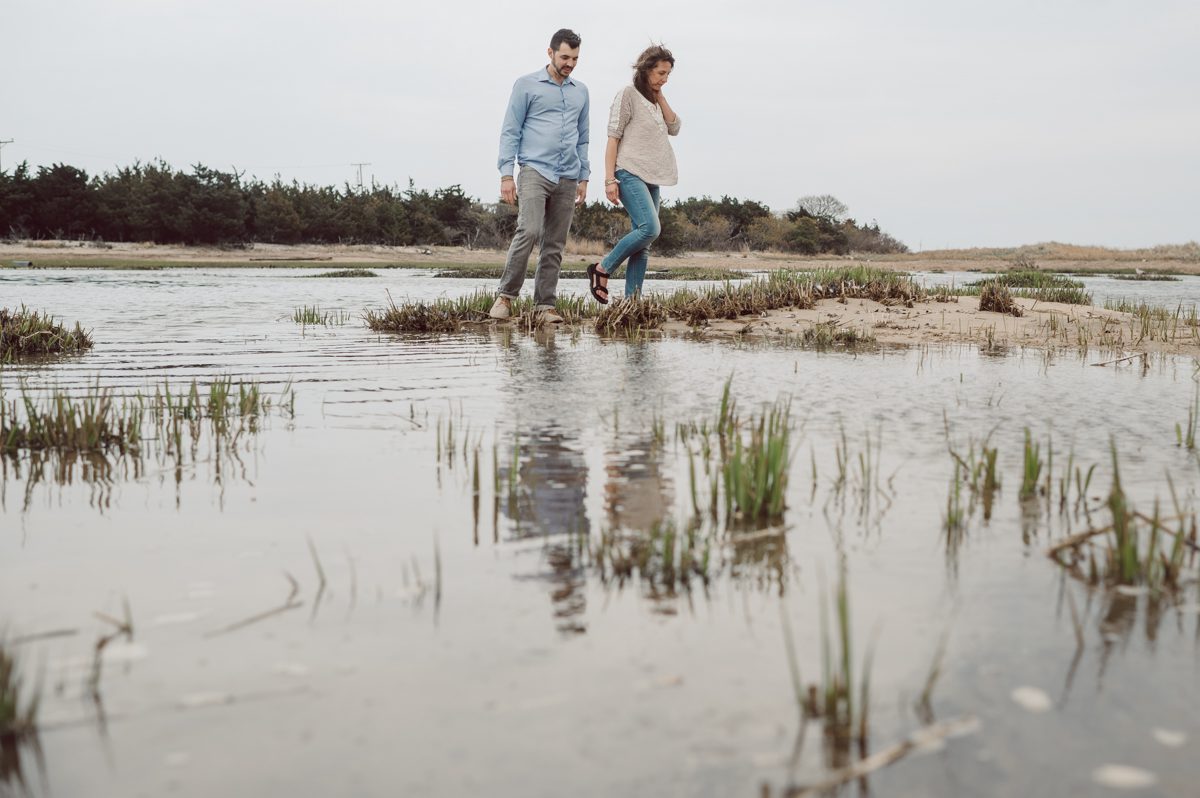 Perfect day would look like this, I said admiring the beach, the landscape and the amazing colors that I was looking out in the horizon. Sky, sea, sand looked as if they were painted in pastel blues, beige, and white. Wind moved, hair dancing, it was going to be fabulous engagement session with Becca and Dan! I fell in love with Sandy Hook Beach, and loved my awesome clients that follows all my weird, silly and sometime awkward directions/posing. My favorite out of Becca and Dan's Sandy Hook engagement session is the one that I got inspired by Wes Anderson's movie "Moonlight Kingdom"! Becca and Dan's Sandy Hook Beach NJ engagement by Karis. Hey Karis is Hudson Valley, Garrison NY and NJ, Fun Weddings and Intimate Elopements Photographer.