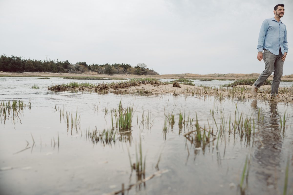 Perfect day would look like this, I said admiring the beach, the landscape and the amazing colors that I was looking out in the horizon. Sky, sea, sand looked as if they were painted in pastel blues, beige, and white. Wind moved, hair dancing, it was going to be fabulous engagement session with Becca and Dan! I fell in love with Sandy Hook Beach, and loved my awesome clients that follows all my weird, silly and sometime awkward directions/posing. My favorite out of Becca and Dan's Sandy Hook engagement session is the one that I got inspired by Wes Anderson's movie "Moonlight Kingdom"! Becca and Dan's Sandy Hook Beach NJ engagement by Karis. Hey Karis is Hudson Valley, Garrison NY and NJ, Fun Weddings and Intimate Elopements Photographer.
