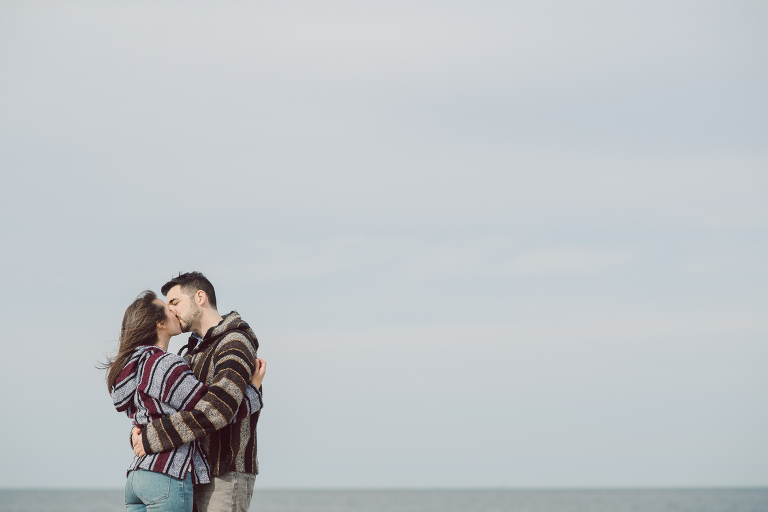 Perfect day would look like this, I said admiring the beach, the landscape and the amazing colors that I was looking out in the horizon. Sky, sea, sand looked as if they were painted in pastel blues, beige, and white. Wind moved, hair dancing, it was going to be fabulous engagement session with Becca and Dan! I fell in love with Sandy Hook Beach, and loved my awesome clients that follows all my weird, silly and sometime awkward directions/posing. My favorite out of Becca and Dan's Sandy Hook engagement session is the one that I got inspired by Wes Anderson's movie "Moonlight Kingdom"! Becca and Dan's Sandy Hook Beach NJ engagement by Karis. Hey Karis is Hudson Valley, Garrison NY and NJ, Fun Weddings and Intimate Elopements Photographer.