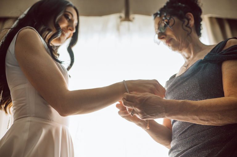 My first wedding of 2022 at Bear Brook Valley NJ celebrating Allie and Nick. It was very cold and windy March day at Bear Brook Valley but Allie and Nick were in their best spirits on their wedding day. Wind made it bit challenging during Allie and Nick's wedding portrait session but instead of fighting against the wind, we worked with the wind's direction becoming one with nature. Allie and Nick smiled, laughed and ran. Quick outdoor ceremony was held out in the front of Bear Brook Valley then for the rest of the evening Allie and Nick with their guests partied, danced in Bear Brook Valley's modern/rustic reception room. Allie and Nick's Bear Brook Valley wedding captured by Karis. Hey Karis is NY, NJ, Brooklyn, Hudson Valley and Catskills Wedding and Elopement Photographer.