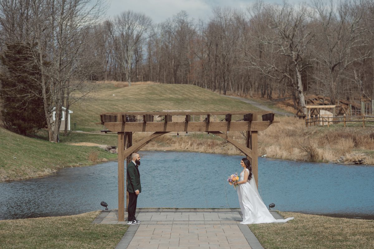 My first wedding of 2022 at Bear Brook Valley NJ celebrating Allie and Nick. It was very cold and windy March day at Bear Brook Valley but Allie and Nick were in their best spirits on their wedding day. Wind made it bit challenging during Allie and Nick's wedding portrait session but instead of fighting against the wind, we worked with the wind's direction becoming one with nature. Allie and Nick smiled, laughed and ran. Quick outdoor ceremony was held out in the front of Bear Brook Valley then for the rest of the evening Allie and Nick with their guests partied, danced in Bear Brook Valley's modern/rustic reception room. Allie and Nick's Bear Brook Valley wedding captured by Karis. Hey Karis is NY, NJ, Brooklyn, Hudson Valley and Catskills Wedding and Elopement Photographer.