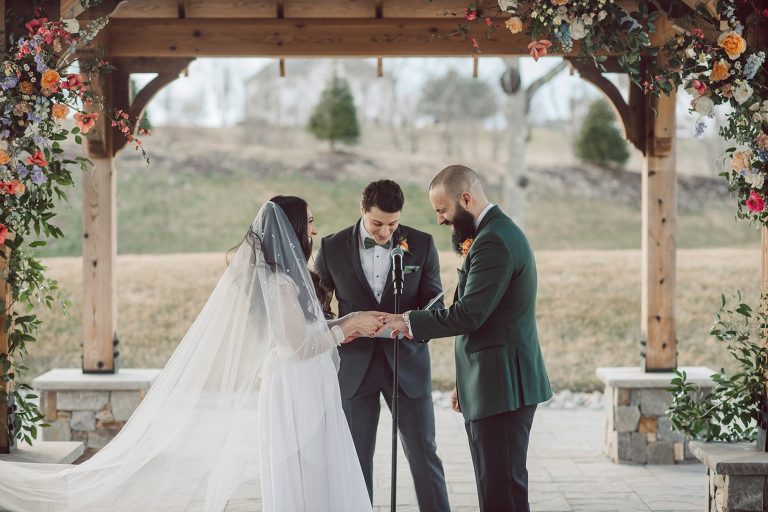 My first wedding of 2022 at Bear Brook Valley NJ celebrating Allie and Nick. It was very cold and windy March day at Bear Brook Valley but Allie and Nick were in their best spirits on their wedding day. Wind made it bit challenging during Allie and Nick's wedding portrait session but instead of fighting against the wind, we worked with the wind's direction becoming one with nature. Allie and Nick smiled, laughed and ran. Quick outdoor ceremony was held out in the front of Bear Brook Valley then for the rest of the evening Allie and Nick with their guests partied, danced in Bear Brook Valley's modern/rustic reception room. Allie and Nick's Bear Brook Valley wedding captured by Karis. Hey Karis is NY, NJ, Brooklyn, Hudson Valley and Catskills Wedding and Elopement Photographer.