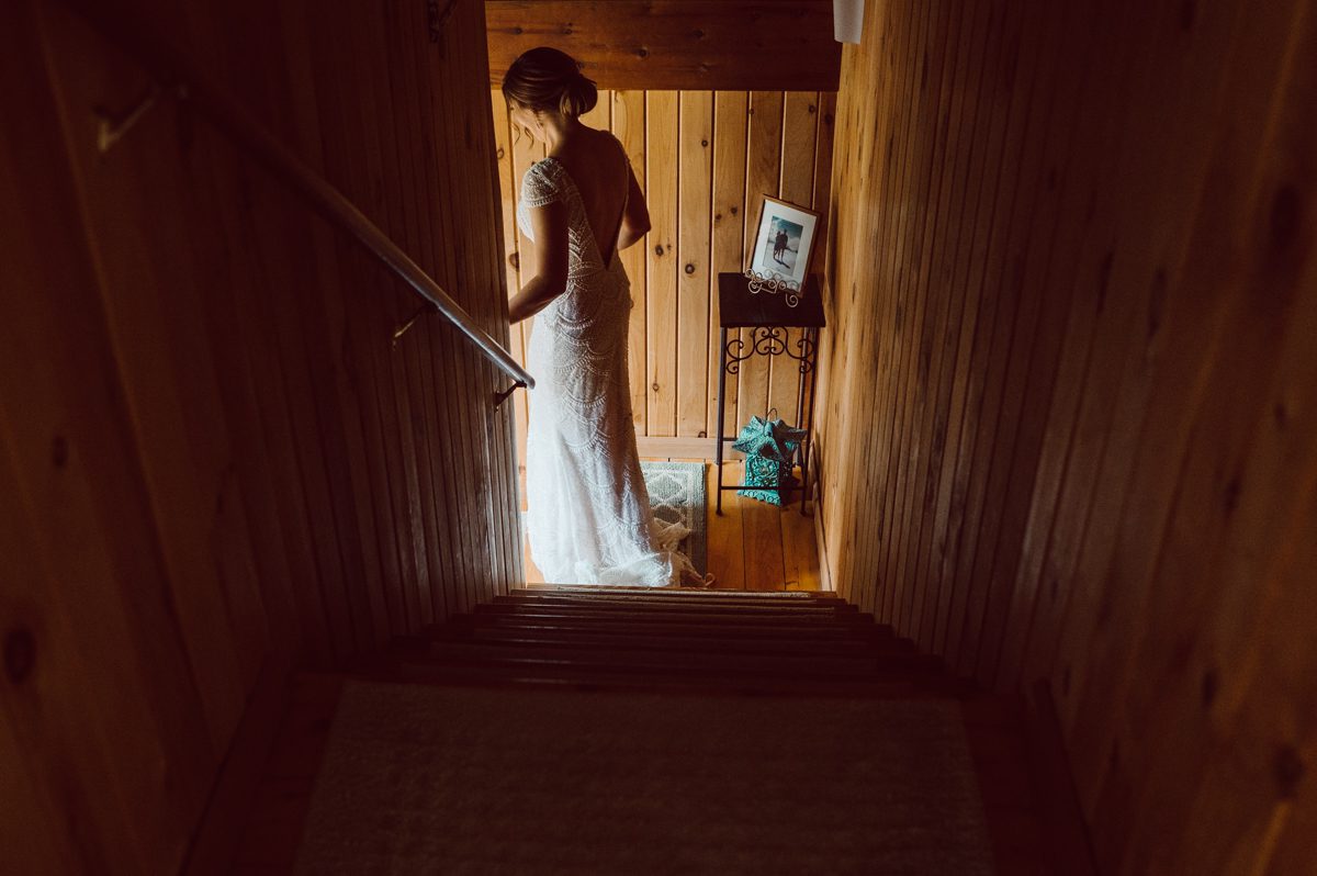 Pulled up to Michell's parents gorgeous mid-century home in Cold Spring, NY on Michelle and Robert's wedding day.  And Robert got ready at an airbnb nearby in Peekskill, NY. Even-though Michelle and Robert had some hiccup with their limo the whole village pulled together and transported Michell and Roberts along with their bridal party to the church Our Lady of Loretto Church to get Michelle and Robert married. Then everyone hoped onto everyone's cars to make their way to West Hills Country Club to party. Michelle and Robert weren't too into taking formal posed portraits but instead wanted to join their friends and guests to enjoy their wedding day, to party, to mingle, to drink and eat the food. Many candid moments were captured, and we wrapped the evening with the most stunning sunset across the field at West Hills Country Club. Michelle and Robert's West Hills Country Club Wedding captured by Hey Karis is NY, NJ, Brooklyn, Hudson Valley and Catskills Wedding and Elopement Photographer.