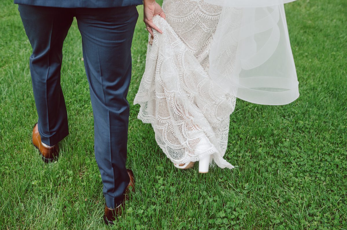 Pulled up to Michell's parents gorgeous mid-century home in Cold Spring, NY on Michelle and Robert's wedding day.  And Robert got ready at an airbnb nearby in Peekskill, NY. Even-though Michelle and Robert had some hiccup with their limo the whole village pulled together and transported Michell and Roberts along with their bridal party to the church Our Lady of Loretto Church to get Michelle and Robert married. Then everyone hoped onto everyone's cars to make their way to West Hills Country Club to party. Michelle and Robert weren't too into taking formal posed portraits but instead wanted to join their friends and guests to enjoy their wedding day, to party, to mingle, to drink and eat the food. Many candid moments were captured, and we wrapped the evening with the most stunning sunset across the field at West Hills Country Club. Michelle and Robert's West Hills Country Club Wedding captured by Hey Karis is NY, NJ, Brooklyn, Hudson Valley and Catskills Wedding and Elopement Photographer.