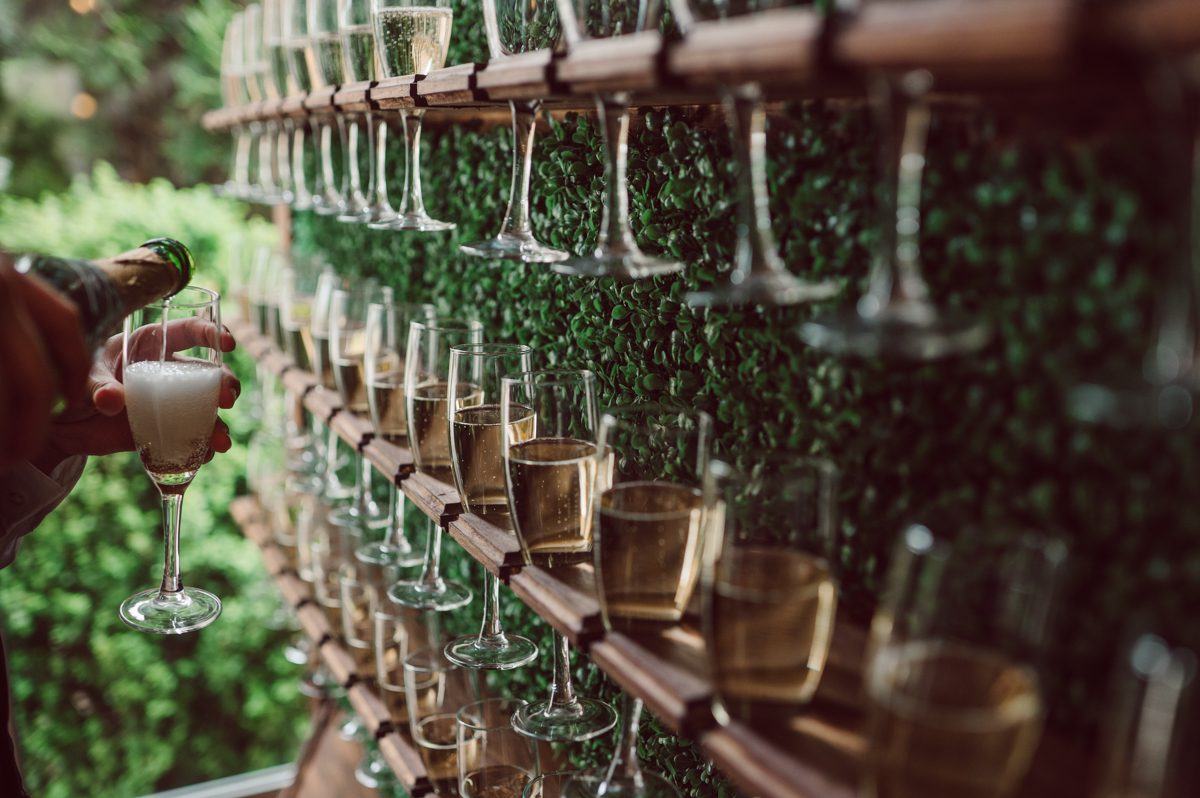 Pulled up to Michell's parents gorgeous mid-century home in Cold Spring, NY on Michelle and Robert's wedding day.  And Robert got ready at an airbnb nearby in Peekskill, NY. Even-though Michelle and Robert had some hiccup with their limo the whole village pulled together and transported Michell and Roberts along with their bridal party to the church Our Lady of Loretto Church to get Michelle and Robert married. Then everyone hoped onto everyone's cars to make their way to West Hills Country Club to party. Michelle and Robert weren't too into taking formal posed portraits but instead wanted to join their friends and guests to enjoy their wedding day, to party, to mingle, to drink and eat the food. Many candid moments were captured, and we wrapped the evening with the most stunning sunset across the field at West Hills Country Club. Michelle and Robert's West Hills Country Club Wedding captured by Hey Karis is NY, NJ, Brooklyn, Hudson Valley and Catskills Wedding and Elopement Photographer.