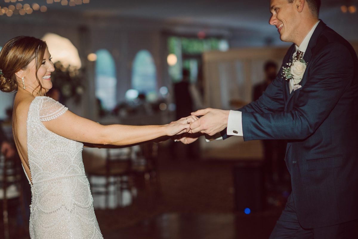 Pulled up to Michell's parents gorgeous mid-century home in Cold Spring, NY on Michelle and Robert's wedding day. And Robert got ready at an airbnb nearby in Peekskill, NY. Even-though Michelle and Robert had some hiccup with their limo the whole village pulled together and transported Michell and Roberts along with their bridal party to the church Our Lady of Loretto Church to get Michelle and Robert married. Then everyone hoped onto everyone's cars to make their way to West Hills Country Club to party. Michelle and Robert weren't too into taking formal posed portraits but instead wanted to join their friends and guests to enjoy their wedding day, to party, to mingle, to drink and eat the food. Many candid moments were captured, and we wrapped the evening with the most stunning sunset across the field at West Hills Country Club. Michelle and Robert's West Hills Country Club Wedding captured by Hey Karis is NY, NJ, Brooklyn, Hudson Valley and Catskills Wedding and Elopement Photographer.