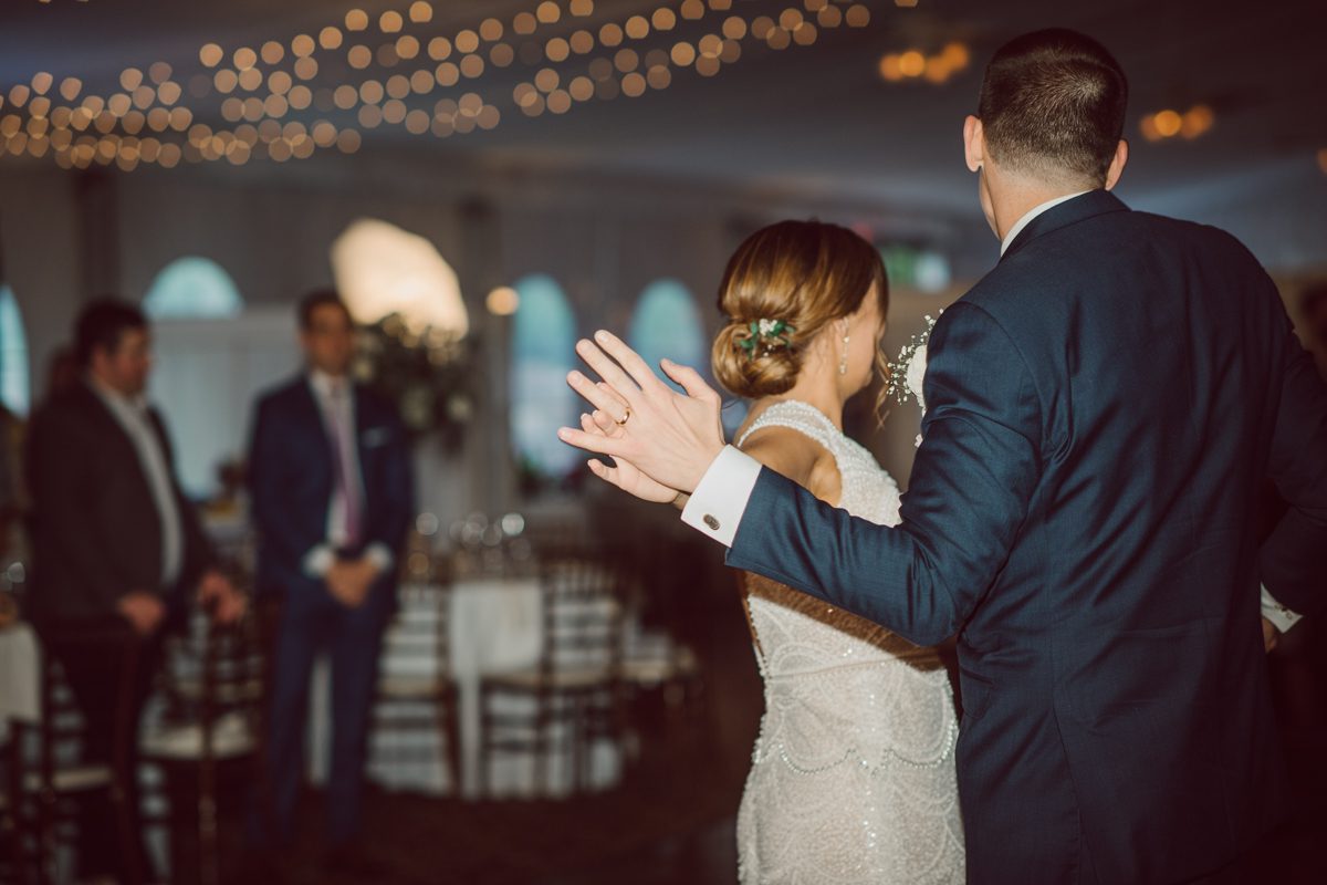 Pulled up to Michell's parents gorgeous mid-century home in Cold Spring, NY on Michelle and Robert's wedding day.  And Robert got ready at an airbnb nearby in Peekskill, NY. Even-though Michelle and Robert had some hiccup with their limo the whole village pulled together and transported Michell and Roberts along with their bridal party to the church Our Lady of Loretto Church to get Michelle and Robert married. Then everyone hoped onto everyone's cars to make their way to West Hills Country Club to party. Michelle and Robert weren't too into taking formal posed portraits but instead wanted to join their friends and guests to enjoy their wedding day, to party, to mingle, to drink and eat the food. Many candid moments were captured, and we wrapped the evening with the most stunning sunset across the field at West Hills Country Club. Michelle and Robert's West Hills Country Club Wedding captured by Hey Karis is NY, NJ, Brooklyn, Hudson Valley and Catskills Wedding and Elopement Photographer.