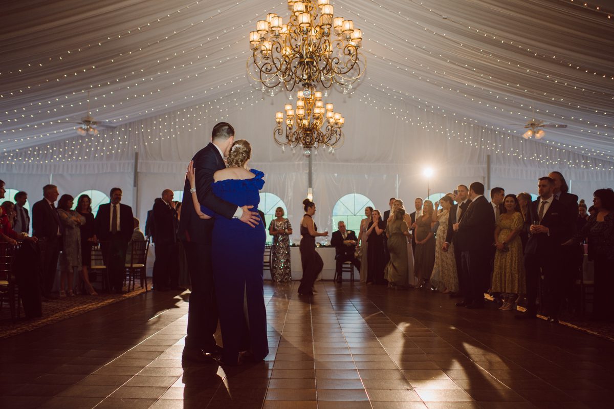 Pulled up to Michell's parents gorgeous mid-century home in Cold Spring, NY on Michelle and Robert's wedding day.  And Robert got ready at an airbnb nearby in Peekskill, NY. Even-though Michelle and Robert had some hiccup with their limo the whole village pulled together and transported Michell and Roberts along with their bridal party to the church Our Lady of Loretto Church to get Michelle and Robert married. Then everyone hoped onto everyone's cars to make their way to West Hills Country Club to party. Michelle and Robert weren't too into taking formal posed portraits but instead wanted to join their friends and guests to enjoy their wedding day, to party, to mingle, to drink and eat the food. Many candid moments were captured, and we wrapped the evening with the most stunning sunset across the field at West Hills Country Club. Michelle and Robert's West Hills Country Club Wedding captured by Hey Karis is NY, NJ, Brooklyn, Hudson Valley and Catskills Wedding and Elopement Photographer.