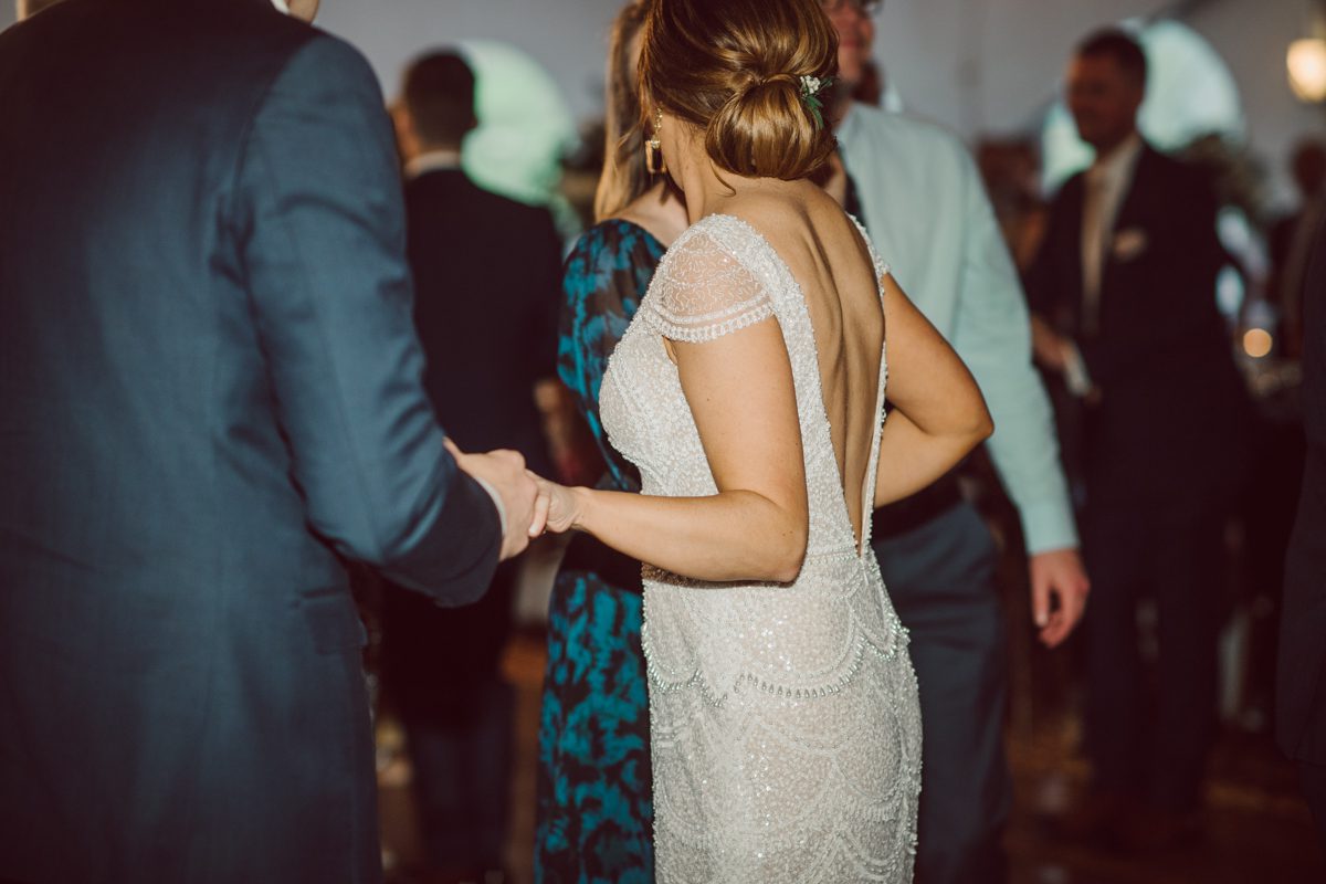 Pulled up to Michell's parents gorgeous mid-century home in Cold Spring, NY on Michelle and Robert's wedding day.  And Robert got ready at an airbnb nearby in Peekskill, NY. Even-though Michelle and Robert had some hiccup with their limo the whole village pulled together and transported Michell and Roberts along with their bridal party to the church Our Lady of Loretto Church to get Michelle and Robert married. Then everyone hoped onto everyone's cars to make their way to West Hills Country Club to party. Michelle and Robert weren't too into taking formal posed portraits but instead wanted to join their friends and guests to enjoy their wedding day, to party, to mingle, to drink and eat the food. Many candid moments were captured, and we wrapped the evening with the most stunning sunset across the field at West Hills Country Club. Michelle and Robert's West Hills Country Club Wedding captured by Hey Karis is NY, NJ, Brooklyn, Hudson Valley and Catskills Wedding and Elopement Photographer.