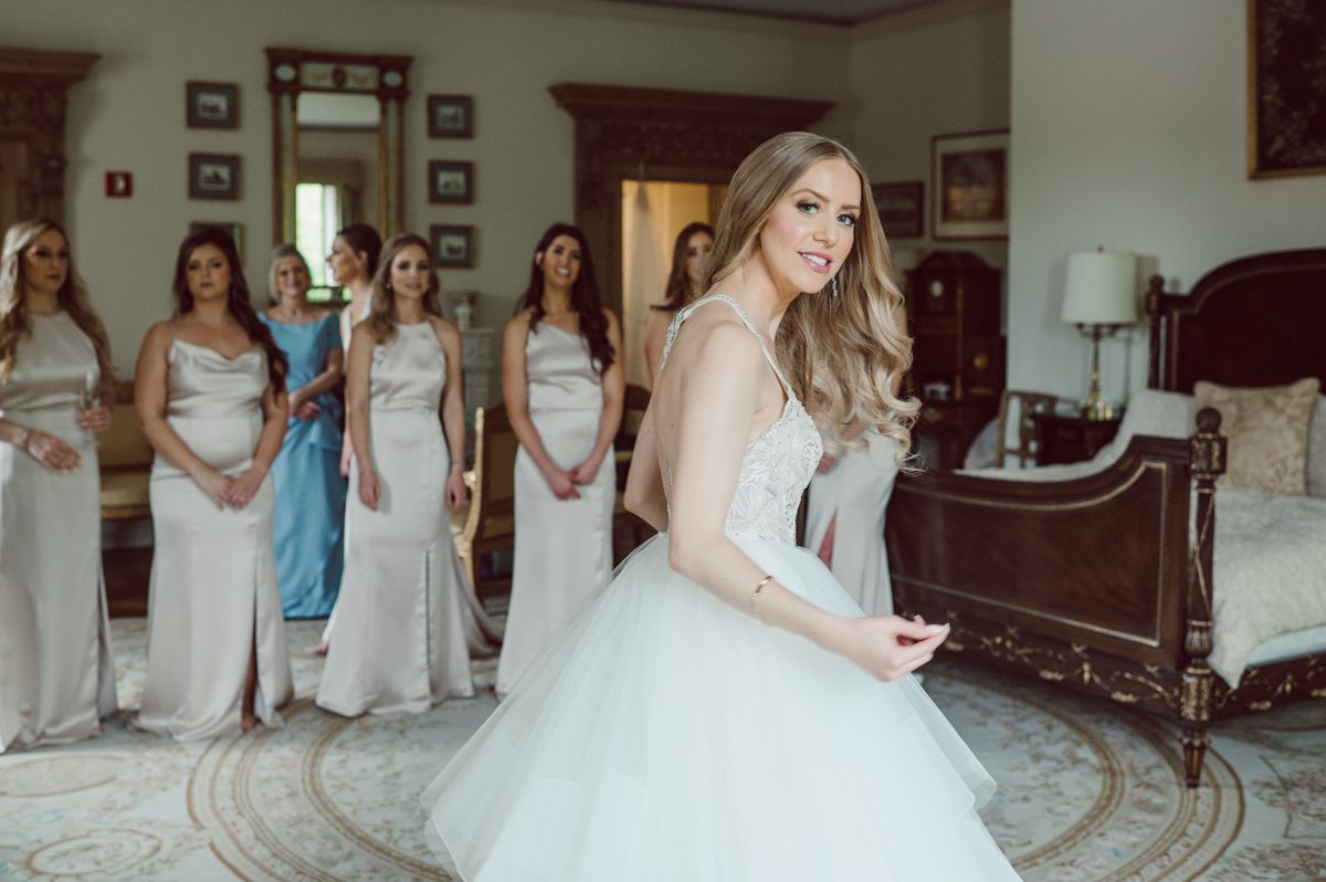 In beautiful Princeton, NJ sits Jasna Polana. This unique wedding venue which is part of TPC Jasna Polana Country Club with it's Tuscany like exterior with cobble stone circular entry way with ground fountain. You'll feel like a royal family when you get married here. It was raining on Hillary and Will's wedding day, so we didn't get to explore the grounds as much as we would have like to but this brave bride Hillary was willing to go out into the rain for outdoor photos on her wedding day. Incredible colors with all the greens, white flowers from the back garden, Hillary's white wedding dress created such a romantic contrast against the deep greens, blues it was such a incredible day. I had such a fun time capturing Hillary and Will on their wedding day at Jasna Polana and can not wait to come back to this gorgeous venue on a dry day to capture more moments. Hillary and Will's Jasna Polana Princeton NJ wedding captured by Karis from Hey Karis NY, NJ, Brooklyn, Hudson Valley and Catskills Wedding and Elopement Photographer.