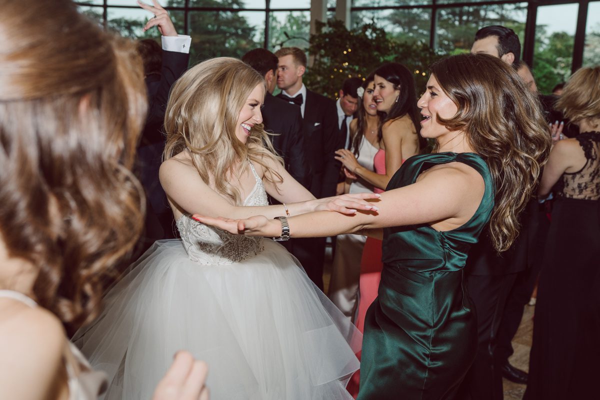 In beautiful Princeton, NJ sits Jasna Polana. This unique wedding venue which is part of TPC Jasna Polana Country Club with it's Tuscany like exterior with cobble stone circular entry way with ground fountain. You'll feel like a royal family when you get married here. It was raining on Hillary and Will's wedding day, so we didn't get to explore the grounds as much as we would have like to but this brave bride Hillary was willing to go out into the rain for outdoor photos on her wedding day. Incredible colors with all the greens, white flowers from the back garden, Hillary's white wedding dress created such a romantic contrast against the deep greens, blues it was such a incredible day. I had such a fun time capturing Hillary and Will on their wedding day at Jasna Polana and can not wait to come back to this gorgeous venue on a dry day to capture more moments. Hillary and Will's Jasna Polana Princeton NJ wedding captured by Karis from Hey Karis NY, NJ, Brooklyn, Hudson Valley and Catskills Wedding and Elopement Photographer.