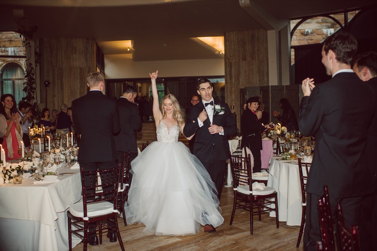 In beautiful Princeton, NJ sits Jasna Polana. This unique wedding venue which is part of TPC Jasna Polana Country Club with it's Tuscany like exterior with cobble stone circular entry way with ground fountain. You'll feel like a royal family when you get married here. It was raining on Hillary and Will's wedding day, so we didn't get to explore the grounds as much as we would have like to but this brave bride Hillary was willing to go out into the rain for outdoor photos on her wedding day. Incredible colors with all the greens, white flowers from the back garden, Hillary's white wedding dress created such a romantic contrast against the deep greens, blues it was such a incredible day. I had such a fun time capturing Hillary and Will on their wedding day at Jasna Polana and can not wait to come back to this gorgeous venue on a dry day to capture more moments. Hillary and Will's Jasna Polana Princeton NJ wedding captured by Karis from Hey Karis NY, NJ, Brooklyn, Hudson Valley and Catskills Wedding and Elopement Photographer.