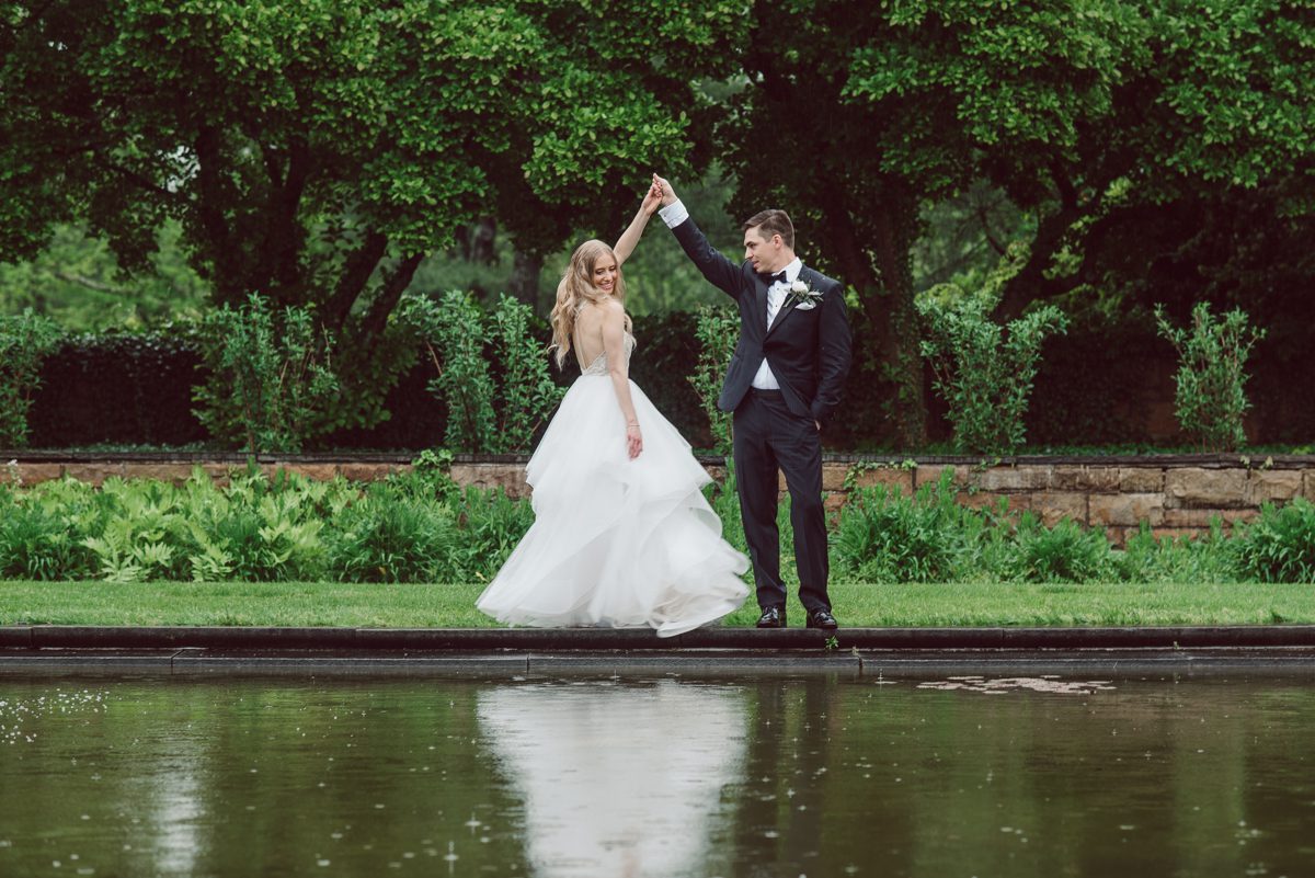 In beautiful Princeton, NJ sits Jasna Polana. This unique wedding venue which is part of TPC Jasna Polana Country Club with it's Tuscany like exterior with cobble stone circular entry way with ground fountain. You'll feel like a royal family when you get married here. It was raining on Hillary and Will's wedding day, so we didn't get to explore the grounds as much as we would have like to but this brave bride Hillary was willing to go out into the rain for outdoor photos on her wedding day. Incredible colors with all the greens, white flowers from the back garden, Hillary's white wedding dress created such a romantic contrast against the deep greens, blues it was such a incredible day. I had such a fun time capturing Hillary and Will on their wedding day at Jasna Polana and can not wait to come back to this gorgeous venue on a dry day to capture more moments. Hillary and Will's Jasna Polana Princeton NJ wedding  captured by Karis from Hey Karis NY, NJ, Brooklyn, Hudson Valley and Catskills Wedding and Elopement Photographer.