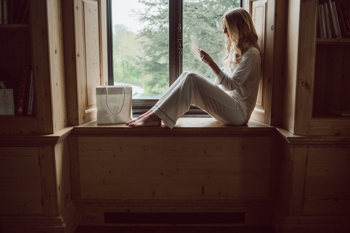 In beautiful Princeton, NJ sits Jasna Polana. This unique wedding venue which is part of TPC Jasna Polana Country Club with it's Tuscany like exterior with cobble stone circular entry way with ground fountain. You'll feel like a royal family when you get married here. It was raining on Hillary and Will's wedding day, so we didn't get to explore the grounds as much as we would have like to but this brave bride Hillary was willing to go out into the rain for outdoor photos on her wedding day. Incredible colors with all the greens, white flowers from the back garden, Hillary's white wedding dress created such a romantic contrast against the deep greens, blues it was such a incredible day. I had such a fun time capturing Hillary and Will on their wedding day at Jasna Polana and can not wait to come back to this gorgeous venue on a dry day to capture more moments. Hillary and Will's Jasna Polana Princeton NJ wedding  captured by Karis from Hey Karis NY, NJ, Brooklyn, Hudson Valley and Catskills Wedding and Elopement Photographer.