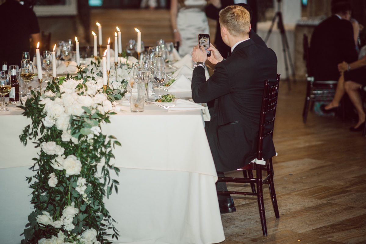 In beautiful Princeton, NJ sits Jasna Polana. This unique wedding venue which is part of TPC Jasna Polana Country Club with it's Tuscany like exterior with cobble stone circular entry way with ground fountain. You'll feel like a royal family when you get married here. It was raining on Hillary and Will's wedding day, so we didn't get to explore the grounds as much as we would have like to but this brave bride Hillary was willing to go out into the rain for outdoor photos on her wedding day. Incredible colors with all the greens, white flowers from the back garden, Hillary's white wedding dress created such a romantic contrast against the deep greens, blues it was such a incredible day. I had such a fun time capturing Hillary and Will on their wedding day at Jasna Polana and can not wait to come back to this gorgeous venue on a dry day to capture more moments. Hillary and Will's Jasna Polana Princeton NJ wedding  captured by Karis from Hey Karis NY, NJ, Brooklyn, Hudson Valley and Catskills Wedding and Elopement Photographer.