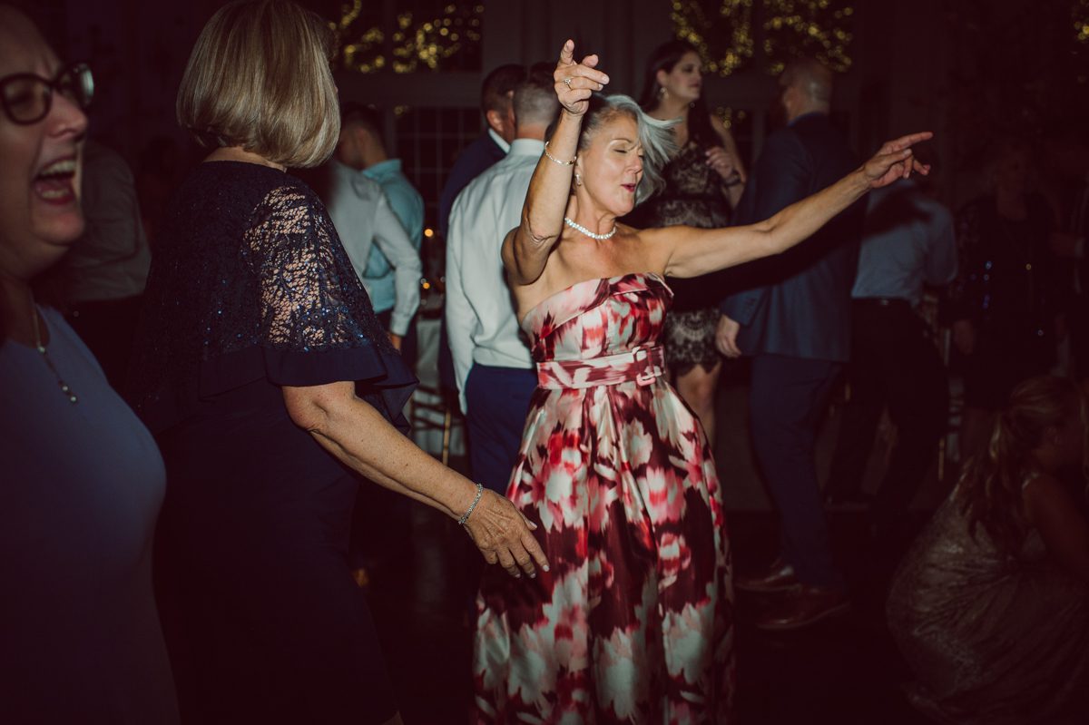 It literally felt like 1000 degrees on Faith and Joe’s wedding at Park Chateau Estate and Gardens. Sun was out and had no plan to hide, not a single cloud in the sky. Despite the gorgeous gardens at Park Chateau Faith and Joe decide to stay cool and alive indoors. I totally don’t blame them, I would much rather be indoor with AC. Thankfully the bridal and groom’s suite at Park Chateau Estate and Gardens is very photogenic with lots of windows. I fully utilized the bridal suite for faith’s getting ready, formal photos with her bridesmaids, first look with her father and her solo photos all before the ceremony. Ceremony was held at the chapel onsite at Park Chateau making everything easy. After the ceremony Faith and Joe did quick few photos outside, some family and group photos then quickly ran indoors before they melted onto the beautiful gardens of Park Chateau. The reception room was filled with peonies and cherry branches it was gorgeous, perfect HOT spring wedding decor. Faith and Joe enjoyed their wedding day the way they wanted by eating drinking and dancing mingling with their guests inside under Cool AC. Faith and Joe’s Park Chateau Estate and Gardens Wedding captured by Karis from Hey Karis NY, NJ, Brooklyn, Hudson Valley and Catskills Wedding and Elopement Photographer.