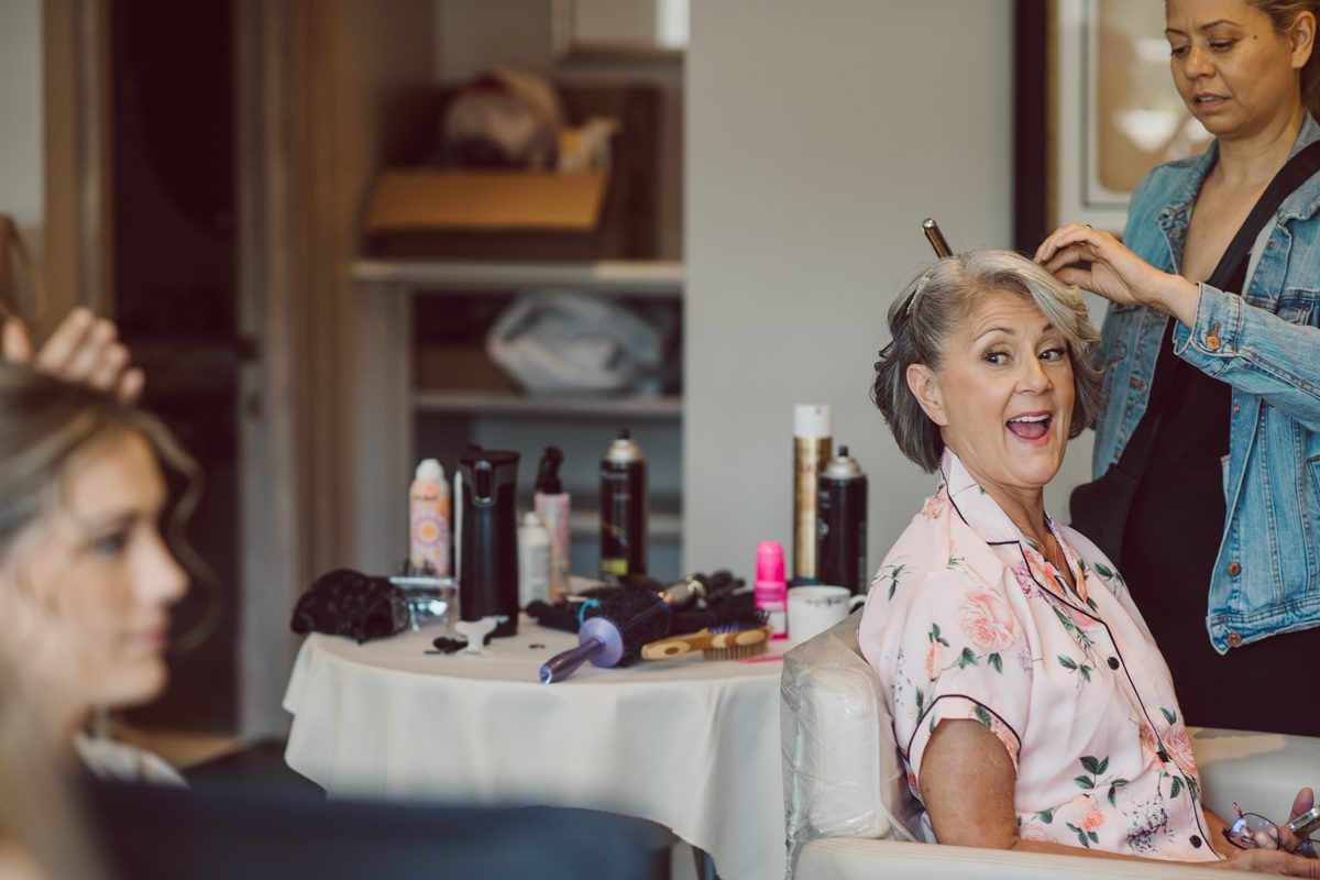 It literally felt like 1000 degrees on Faith and Joe’s wedding at Park Chateau Estate and Gardens. Sun was out and had no plan to hide, not a single cloud in the sky. Despite the gorgeous gardens at Park Chateau Faith and Joe decide to stay cool and alive indoors. I totally don’t blame them, I would much rather be indoor with AC. Thankfully the bridal and groom’s suite at Park Chateau Estate and Gardens is very photogenic with lots of windows. I fully utilized the bridal suite for faith’s getting ready, formal photos with her bridesmaids, first look with her father and her solo photos all before the ceremony. Ceremony was held at the chapel onsite at Park Chateau making everything easy. After the ceremony Faith and Joe did quick few photos outside, some family and group photos then quickly ran indoors before they melted onto the beautiful gardens of Park Chateau. The reception room was filled with peonies and cherry branches it was gorgeous, perfect HOT spring wedding decor. Faith and Joe enjoyed their wedding day the way they wanted by eating drinking and dancing mingling with their guests inside under Cool AC. Faith and Joe’s Park Chateau Estate and Gardens Wedding captured by Karis from Hey Karis NY, NJ, Brooklyn, Hudson Valley and Catskills Wedding and Elopement Photographer.