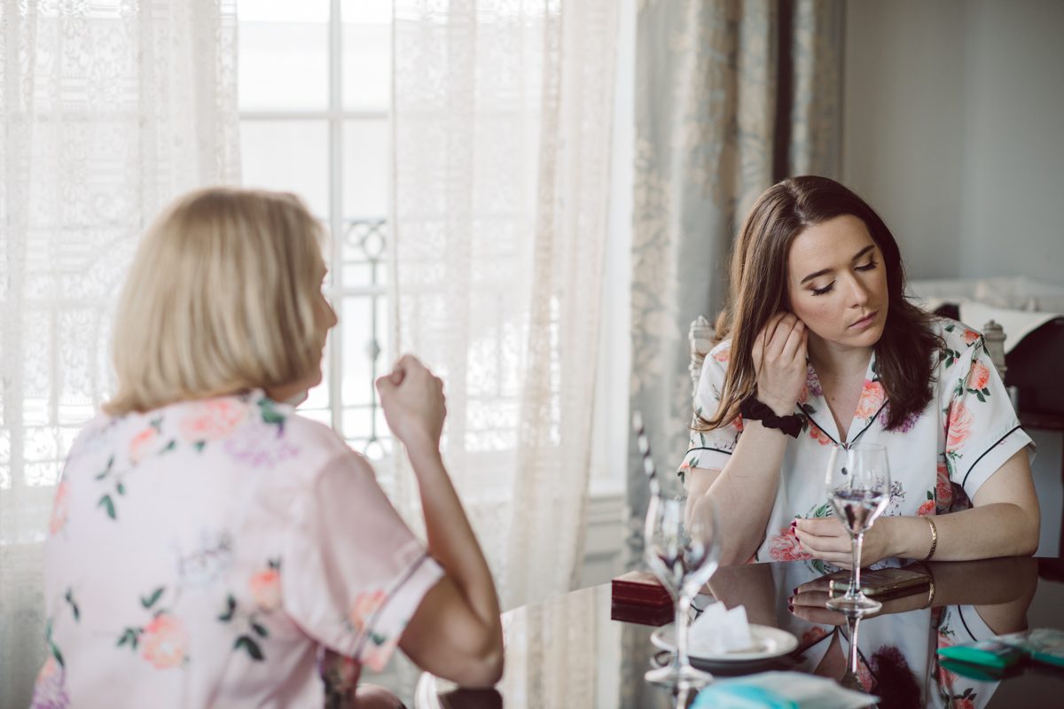 It literally felt like 1000 degrees on Faith and Joe’s wedding at Park Chateau Estate and Gardens. Sun was out and had no plan to hide, not a single cloud in the sky. Despite the gorgeous gardens at Park Chateau Faith and Joe decide to stay cool and alive indoors. I totally don’t blame them, I would much rather be indoor with AC. Thankfully the bridal and groom’s suite at Park Chateau Estate and Gardens is very photogenic with lots of windows. I fully utilized the bridal suite for faith’s getting ready, formal photos with her bridesmaids, first look with her father and her solo photos all before the ceremony. Ceremony was held at the chapel onsite at Park Chateau making everything easy. After the ceremony Faith and Joe did quick few photos outside, some family and group photos then quickly ran indoors before they melted onto the beautiful gardens of Park Chateau. The reception room was filled with peonies and cherry branches it was gorgeous, perfect HOT spring wedding decor. Faith and Joe enjoyed their wedding day the way they wanted by eating drinking and dancing mingling with their guests inside under Cool AC. Faith and Joe’s Park Chateau Estate and Gardens Wedding captured by Karis from Hey Karis NY, NJ, Brooklyn, Hudson Valley and Catskills Wedding and Elopement Photographer.