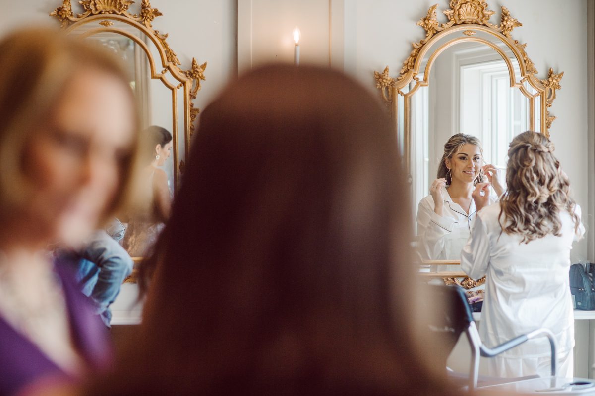 It literally felt like 1000 degrees on Faith and Joe’s wedding at Park Chateau Estate and Gardens. Sun was out and had no plan to hide, not a single cloud in the sky. Despite the gorgeous gardens at Park Chateau Faith and Joe decide to stay cool and alive indoors. I totally don’t blame them, I would much rather be indoor with AC. Thankfully the bridal and groom’s suite at Park Chateau Estate and Gardens is very photogenic with lots of windows. I fully utilized the bridal suite for faith’s getting ready, formal photos with her bridesmaids, first look with her father and her solo photos all before the ceremony. Ceremony was held at the chapel onsite at Park Chateau making everything easy. After the ceremony Faith and Joe did quick few photos outside, some family and group photos then quickly ran indoors before they melted onto the beautiful gardens of Park Chateau. The reception room was filled with peonies and cherry branches it was gorgeous, perfect HOT spring wedding decor. Faith and Joe enjoyed their wedding day the way they wanted by eating drinking and dancing mingling with their guests inside under Cool AC. Faith and Joe’s Park Chateau Estate and Gardens Wedding captured by Karis from Hey Karis NY, NJ, Brooklyn, Hudson Valley and Catskills Wedding and Elopement Photographer.