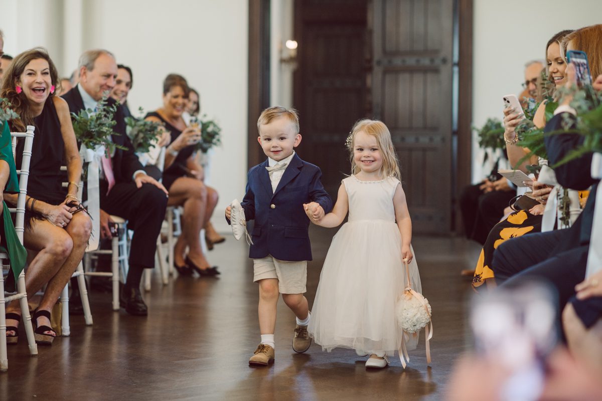 It literally felt like 1000 degrees on Faith and Joe’s wedding at Park Chateau Estate and Gardens. Sun was out and had no plan to hide, not a single cloud in the sky. Despite the gorgeous gardens at Park Chateau Faith and Joe decide to stay cool and alive indoors. I totally don’t blame them, I would much rather be indoor with AC. Thankfully the bridal and groom’s suite at Park Chateau Estate and Gardens is very photogenic with lots of windows. I fully utilized the bridal suite for faith’s getting ready, formal photos with her bridesmaids, first look with her father and her solo photos all before the ceremony. Ceremony was held at the chapel onsite at Park Chateau making everything easy. After the ceremony Faith and Joe did quick few photos outside, some family and group photos then quickly ran indoors before they melted onto the beautiful gardens of Park Chateau. The reception room was filled with peonies and cherry branches it was gorgeous, perfect HOT spring wedding decor. Faith and Joe enjoyed their wedding day the way they wanted by eating drinking and dancing mingling with their guests inside under Cool AC. Faith and Joe’s Park Chateau Estate and Gardens Wedding captured by Karis from Hey Karis NY, NJ, Brooklyn, Hudson Valley and Catskills Wedding and Elopement Photographer.