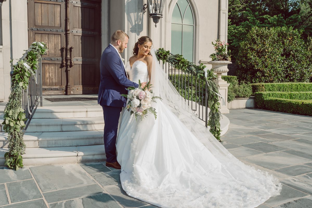 It literally felt like 1000 degrees on Faith and Joe’s wedding at Park Chateau Estate and Gardens. Sun was out and had no plan to hide, not a single cloud in the sky. Despite the gorgeous gardens at Park Chateau Faith and Joe decide to stay cool and alive indoors. I totally don’t blame them, I would much rather be indoor with AC. Thankfully the bridal and groom’s suite at Park Chateau Estate and Gardens is very photogenic with lots of windows. I fully utilized the bridal suite for faith’s getting ready, formal photos with her bridesmaids, first look with her father and her solo photos all before the ceremony. Ceremony was held at the chapel onsite at Park Chateau making everything easy. After the ceremony Faith and Joe did quick few photos outside, some family and group photos then quickly ran indoors before they melted onto the beautiful gardens of Park Chateau. The reception room was filled with peonies and cherry branches it was gorgeous, perfect HOT spring wedding decor. Faith and Joe enjoyed their wedding day the way they wanted by eating drinking and dancing mingling with their guests inside under Cool AC. Faith and Joe’s Park Chateau Estate and Gardens Wedding captured by Karis from Hey Karis NY, NJ, Brooklyn, Hudson Valley and Catskills Wedding and Elopement Photographer.