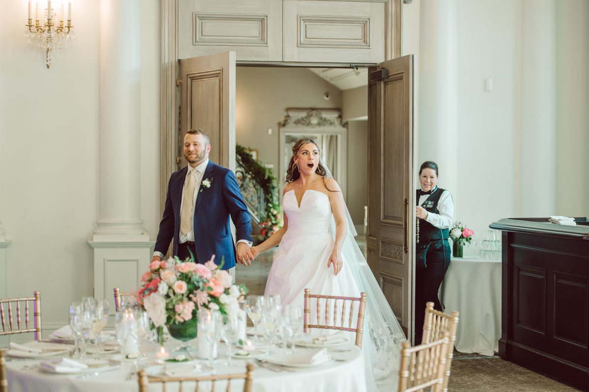 It literally felt like 1000 degrees on Faith and Joe’s wedding at Park Chateau Estate and Gardens. Sun was out and had no plan to hide, not a single cloud in the sky. Despite the gorgeous gardens at Park Chateau Faith and Joe decide to stay cool and alive indoors. I totally don’t blame them, I would much rather be indoor with AC. Thankfully the bridal and groom’s suite at Park Chateau Estate and Gardens is very photogenic with lots of windows. I fully utilized the bridal suite for faith’s getting ready, formal photos with her bridesmaids, first look with her father and her solo photos all before the ceremony. Ceremony was held at the chapel onsite at Park Chateau making everything easy. After the ceremony Faith and Joe did quick few photos outside, some family and group photos then quickly ran indoors before they melted onto the beautiful gardens of Park Chateau. The reception room was filled with peonies and cherry branches it was gorgeous, perfect HOT spring wedding decor. Faith and Joe enjoyed their wedding day the way they wanted by eating drinking and dancing mingling with their guests inside under Cool AC. Faith and Joe’s Park Chateau Estate and Gardens Wedding captured by Karis from Hey Karis NY, NJ, Brooklyn, Hudson Valley and Catskills Wedding and Elopement Photographer.