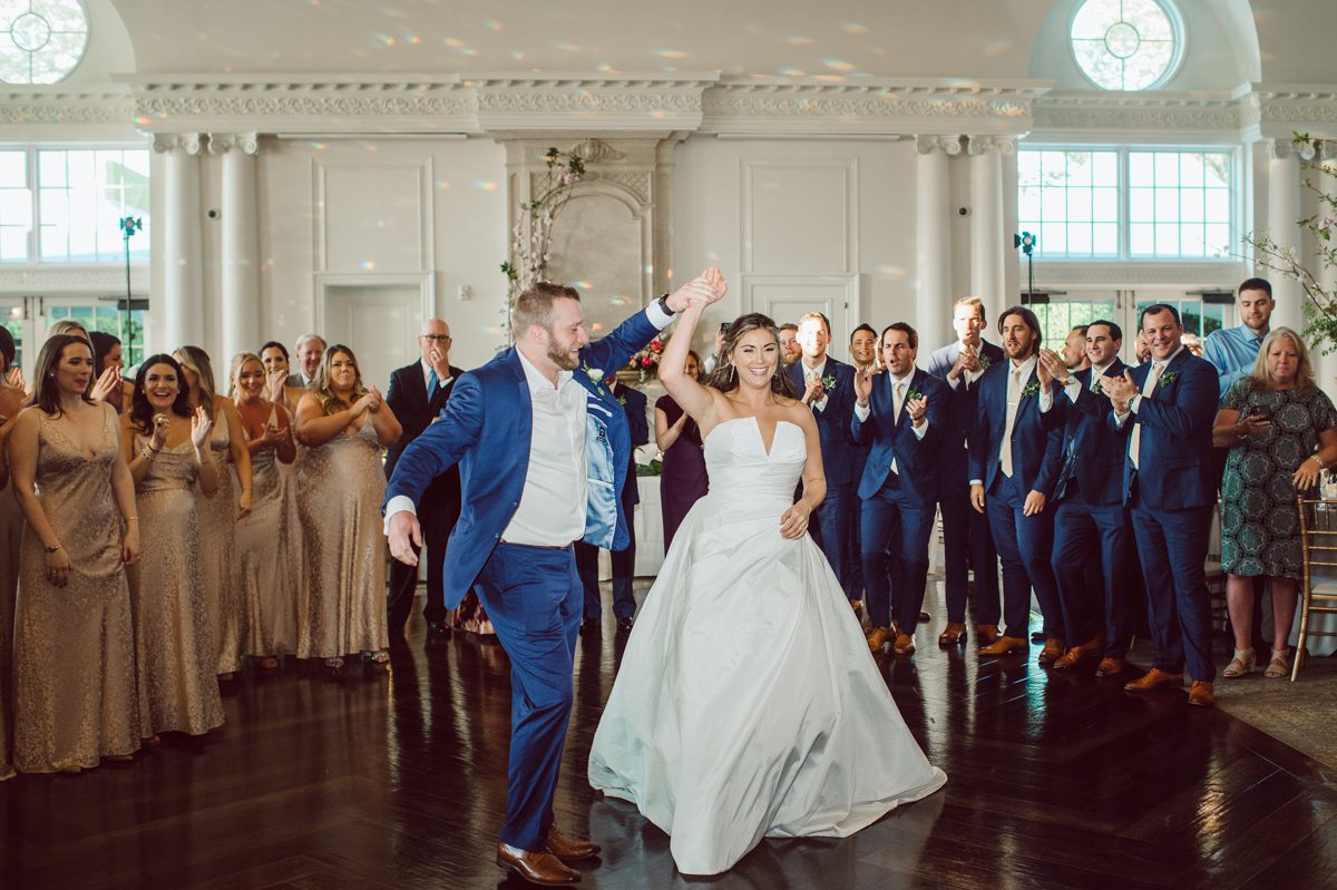 It literally felt like 1000 degrees on Faith and Joe’s wedding at Park Chateau Estate and Gardens. Sun was out and had no plan to hide, not a single cloud in the sky. Despite the gorgeous gardens at Park Chateau Faith and Joe decide to stay cool and alive indoors. I totally don’t blame them, I would much rather be indoor with AC. Thankfully the bridal and groom’s suite at Park Chateau Estate and Gardens is very photogenic with lots of windows. I fully utilized the bridal suite for faith’s getting ready, formal photos with her bridesmaids, first look with her father and her solo photos all before the ceremony. Ceremony was held at the chapel onsite at Park Chateau making everything easy. After the ceremony Faith and Joe did quick few photos outside, some family and group photos then quickly ran indoors before they melted onto the beautiful gardens of Park Chateau. The reception room was filled with peonies and cherry branches it was gorgeous, perfect HOT spring wedding decor. Faith and Joe enjoyed their wedding day the way they wanted by eating drinking and dancing mingling with their guests inside under Cool AC. Faith and Joe’s Park Chateau Estate and Gardens Wedding captured by Karis from Hey Karis NY, NJ, Brooklyn, Hudson Valley and Catskills Wedding and Elopement Photographer.