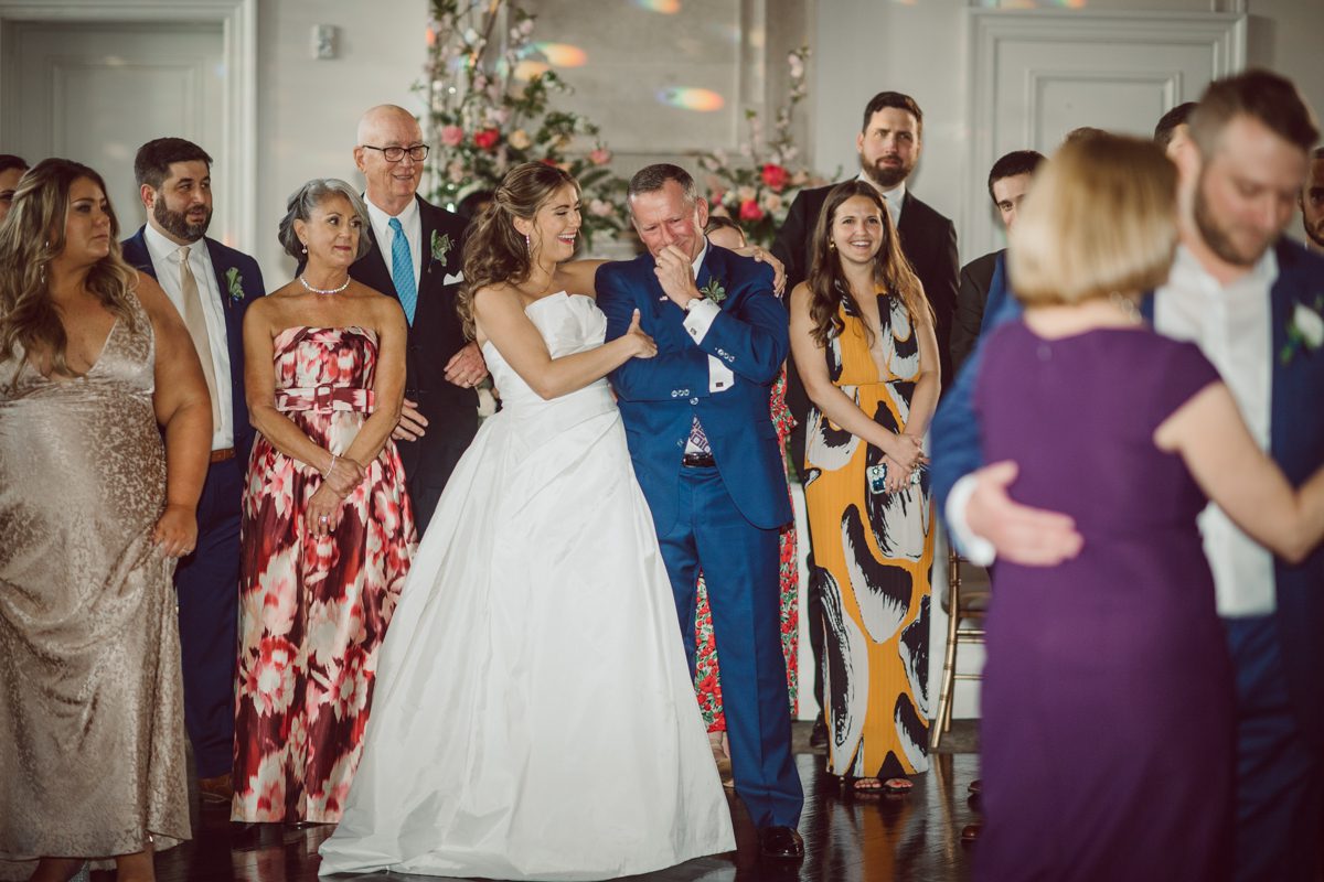 It literally felt like 1000 degrees on Faith and Joe’s wedding at Park Chateau Estate and Gardens. Sun was out and had no plan to hide, not a single cloud in the sky. Despite the gorgeous gardens at Park Chateau Faith and Joe decide to stay cool and alive indoors. I totally don’t blame them, I would much rather be indoor with AC. Thankfully the bridal and groom’s suite at Park Chateau Estate and Gardens is very photogenic with lots of windows. I fully utilized the bridal suite for faith’s getting ready, formal photos with her bridesmaids, first look with her father and her solo photos all before the ceremony. Ceremony was held at the chapel onsite at Park Chateau making everything easy. After the ceremony Faith and Joe did quick few photos outside, some family and group photos then quickly ran indoors before they melted onto the beautiful gardens of Park Chateau. The reception room was filled with peonies and cherry branches it was gorgeous, perfect HOT spring wedding decor. Faith and Joe enjoyed their wedding day the way they wanted by eating drinking and dancing mingling with their guests inside under Cool AC. Faith and Joe’s Park Chateau Estate and Gardens Wedding captured by Karis from Hey Karis NY, NJ, Brooklyn, Hudson Valley and Catskills Wedding and Elopement Photographer.