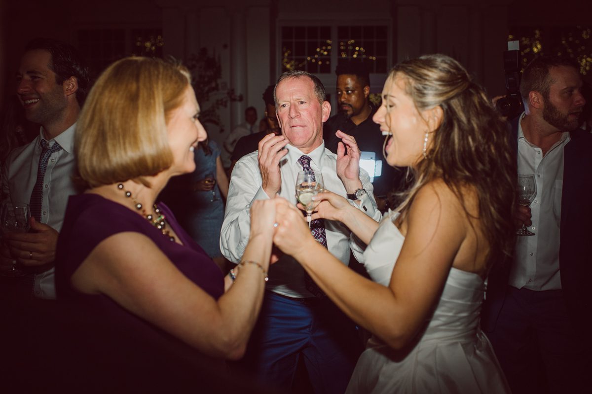 It literally felt like 1000 degrees on Faith and Joe’s wedding at Park Chateau Estate and Gardens. Sun was out and had no plan to hide, not a single cloud in the sky. Despite the gorgeous gardens at Park Chateau Faith and Joe decide to stay cool and alive indoors. I totally don’t blame them, I would much rather be indoor with AC. Thankfully the bridal and groom’s suite at Park Chateau Estate and Gardens is very photogenic with lots of windows. I fully utilized the bridal suite for faith’s getting ready, formal photos with her bridesmaids, first look with her father and her solo photos all before the ceremony. Ceremony was held at the chapel onsite at Park Chateau making everything easy. After the ceremony Faith and Joe did quick few photos outside, some family and group photos then quickly ran indoors before they melted onto the beautiful gardens of Park Chateau. The reception room was filled with peonies and cherry branches it was gorgeous, perfect HOT spring wedding decor. Faith and Joe enjoyed their wedding day the way they wanted by eating drinking and dancing mingling with their guests inside under Cool AC. Faith and Joe’s Park Chateau Estate and Gardens Wedding captured by Karis from Hey Karis NY, NJ, Brooklyn, Hudson Valley and Catskills Wedding and Elopement Photographer.