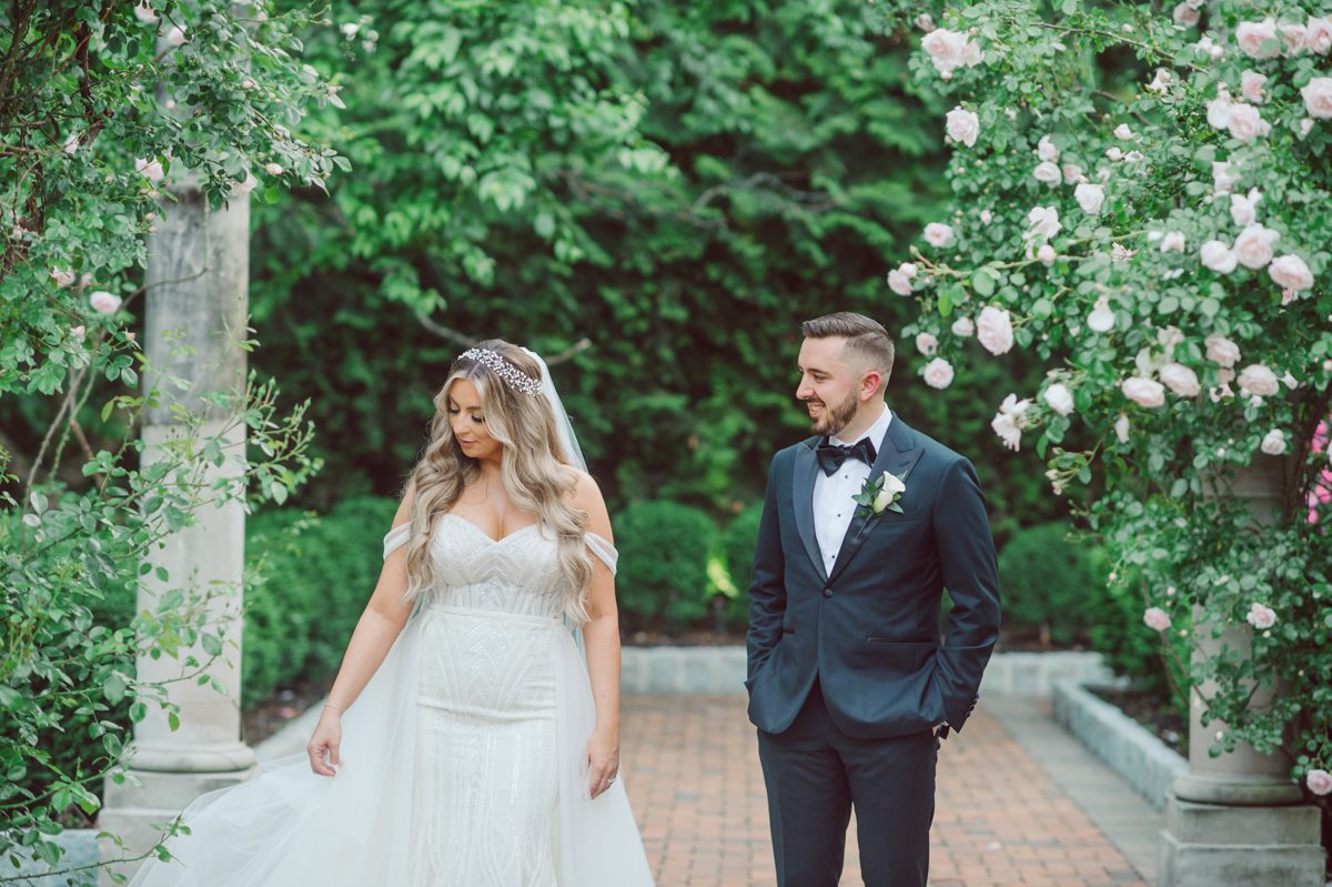 At Florentine Gardens in River Vale NJ celebrating Sam and Mike's wedding. Here at Florentine Gardens you'll get your amazing ballroom, gorgeous landscaped garden and during Sam and Mike's wedding day the roses were in full bloom it was truly beautiful. With roses in full bloom at the rose garden in Florentine Gardens, Sam and Mike's outdoor wedding ceremony was gorgeous bit hot but so gorgeous. And we were fully able to enjoy the roses during Sam and Mike's wedding portrait session. Sam and Mike's Florentine Gardens, NJ wedding captured by Karis from Hey Karis NY, NJ, Brooklyn, Hudson Valley and Catskills Wedding and Elopement Photographer.