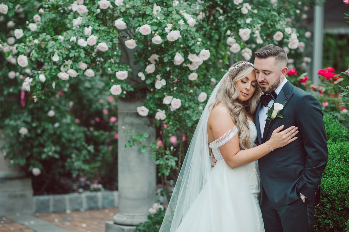 At Florentine Gardens in River Vale NJ celebrating Sam and Mike's wedding. Here at Florentine Gardens you'll get your amazing ballroom, gorgeous landscaped garden and during Sam and Mike's wedding day the roses were in full bloom it was truly beautiful. With roses in full bloom at the rose garden in Florentine Gardens, Sam and Mike's outdoor wedding ceremony was gorgeous bit hot but so gorgeous. And we were fully able to enjoy the roses during Sam and Mike's wedding portrait session. Sam and Mike's Florentine Gardens, NJ wedding captured by Karis from Hey Karis NY, NJ, Brooklyn, Hudson Valley and Catskills Wedding and Elopement Photographer.