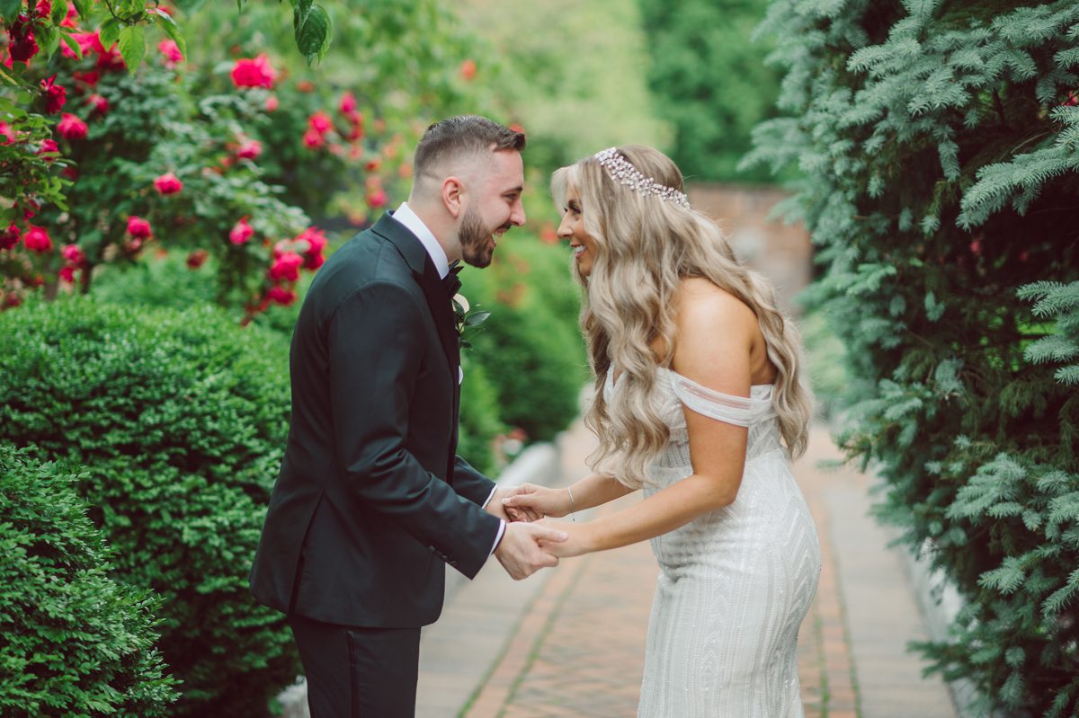 At Florentine Gardens in River Vale NJ celebrating Sam and Mike's wedding. Here at Florentine Gardens you'll get your amazing ballroom, gorgeous landscaped garden and during Sam and Mike's wedding day the roses were in full bloom it was truly beautiful. With roses in full bloom at the rose garden in Florentine Gardens, Sam and Mike's outdoor wedding ceremony was gorgeous bit hot but so gorgeous. And we were fully able to enjoy the roses during Sam and Mike's wedding portrait session. Sam and Mike's Florentine Gardens, NJ wedding captured by Karis from Hey Karis NY, NJ, Brooklyn, Hudson Valley and Catskills Wedding and Elopement Photographer.