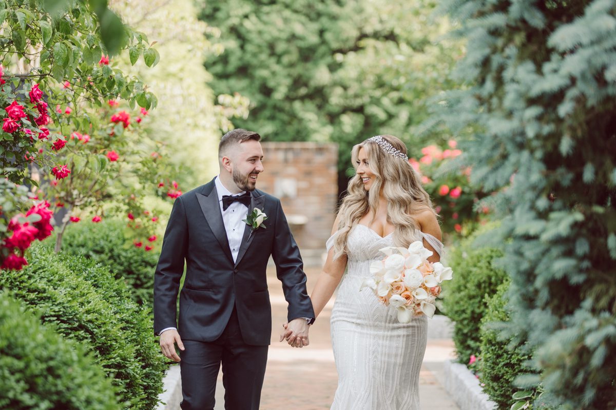 At Florentine Gardens in River Vale NJ celebrating Sam and Mike's wedding. Here at Florentine Gardens you'll get your amazing ballroom, gorgeous landscaped garden and during Sam and Mike's wedding day the roses were in full bloom it was truly beautiful. With roses in full bloom at the rose garden in Florentine Gardens, Sam and Mike's outdoor wedding ceremony was gorgeous bit hot but so gorgeous. And we were fully able to enjoy the roses during Sam and Mike's wedding portrait session. Sam and Mike's Florentine Gardens, NJ wedding captured by Karis from Hey Karis NY, NJ, Brooklyn, Hudson Valley and Catskills Wedding and Elopement Photographer.