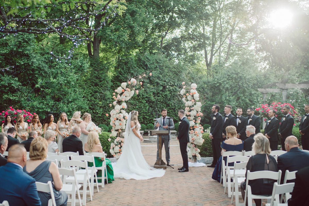 At Florentine Gardens in River Vale NJ celebrating Sam and Mike's wedding. Here at Florentine Gardens you'll get your amazing ballroom, gorgeous landscaped garden and during Sam and Mike's wedding day the roses were in full bloom it was truly beautiful. With roses in full bloom at the rose garden in Florentine Gardens, Sam and Mike's outdoor wedding ceremony was gorgeous bit hot but so gorgeous. And we were fully able to enjoy the roses during Sam and Mike's wedding portrait session. Sam and Mike's Florentine Gardens, NJ wedding captured by Karis from Hey Karis NY, NJ, Brooklyn, Hudson Valley and Catskills Wedding and Elopement Photographer.