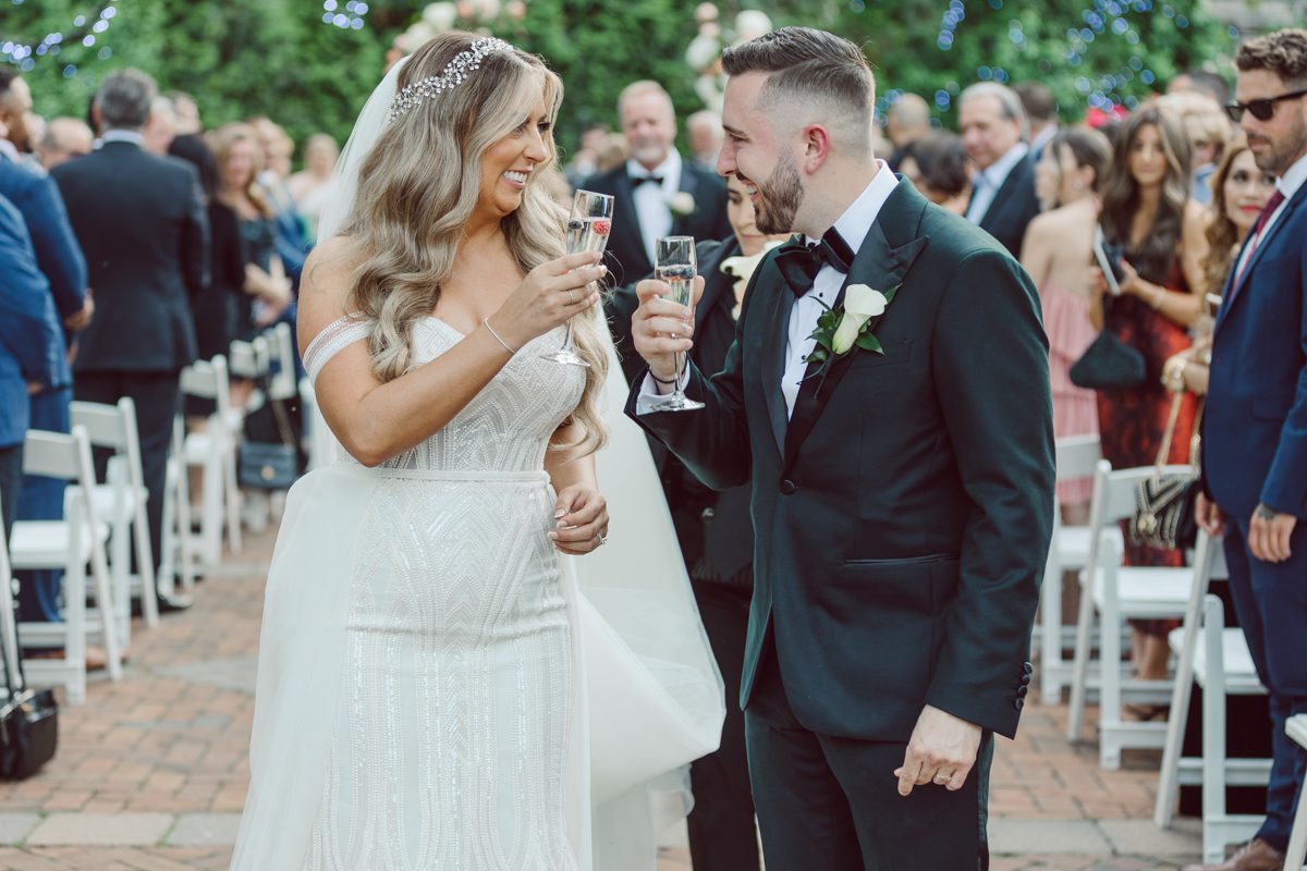 At Florentine Gardens in River Vale NJ celebrating Sam and Mike's wedding. Here at Florentine Gardens you'll get your amazing ballroom, gorgeous landscaped garden and during Sam and Mike's wedding day the roses were in full bloom it was truly beautiful. With roses in full bloom at the rose garden in Florentine Gardens, Sam and Mike's outdoor wedding ceremony was gorgeous bit hot but so gorgeous. And we were fully able to enjoy the roses during Sam and Mike's wedding portrait session. Sam and Mike's Florentine Gardens, NJ wedding captured by Karis from Hey Karis NY, NJ, Brooklyn, Hudson Valley and Catskills Wedding and Elopement Photographer.