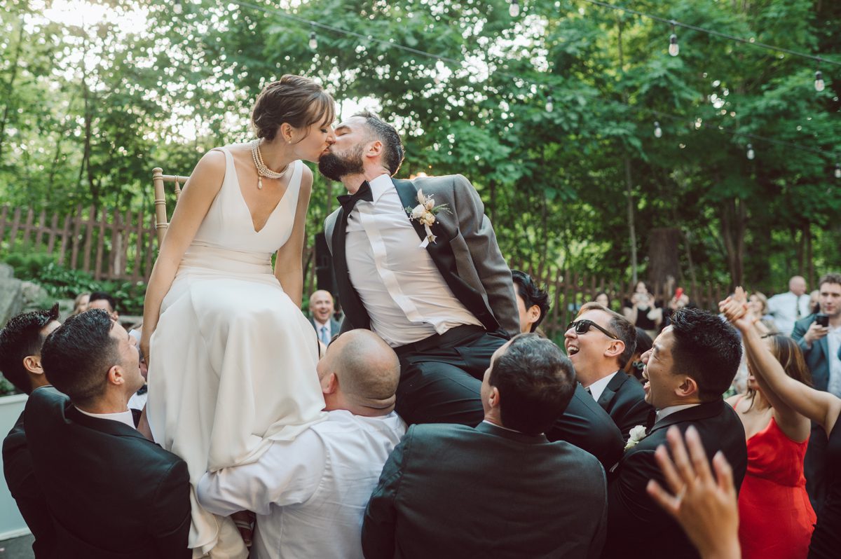 Arrow Park, a wedding venue located in Monroe NY along the Hudson Valley is truly a magical place to celebrate your wedding in a relaxing environment. Your family and friends will appreciate this unplug, retreat type of environment surrounded by nature, historic mansion with courtyard for an outdoor wedding under cafe lights, Arrow Lake, and beautiful garden. I love this place, I can come here every weekend! And Jackie and Aron were the perfect couple for this magical venue to get married and dance away the beautiful summer evening under the cafe light in their courtyard. It was like a scene from a movie, or a wedding from chateau in Italy. Jackie and Aron's Arrow Park, NY Hudson Valley NY wedding captured by Karis from Hey Karis NY, NJ, Brooklyn, Hudson Valley and Catskills Wedding and Elopement Photographer.