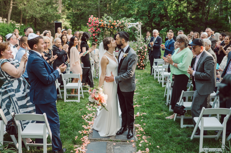 Arrow Park, a wedding venue located in Monroe NY along the Hudson Valley is truly a magical place to celebrate your wedding in a relaxing environment. Your family and friends will appreciate this unplug, retreat type of environment surrounded by nature, historic mansion with courtyard for an outdoor wedding under cafe lights, Arrow Lake, and beautiful garden. I love this place, I can come here every weekend! And Jackie and Aron were the perfect couple for this magical venue to get married and dance away the beautiful summer evening under the cafe light in their courtyard. It was like a scene from a movie, or a wedding from chateau in Italy. Jackie and Aron's Arrow Park, NY Hudson Valley NY wedding captured by Karis from Hey Karis NY, NJ, Brooklyn, Hudson Valley and Catskills Wedding and Elopement Photographer.