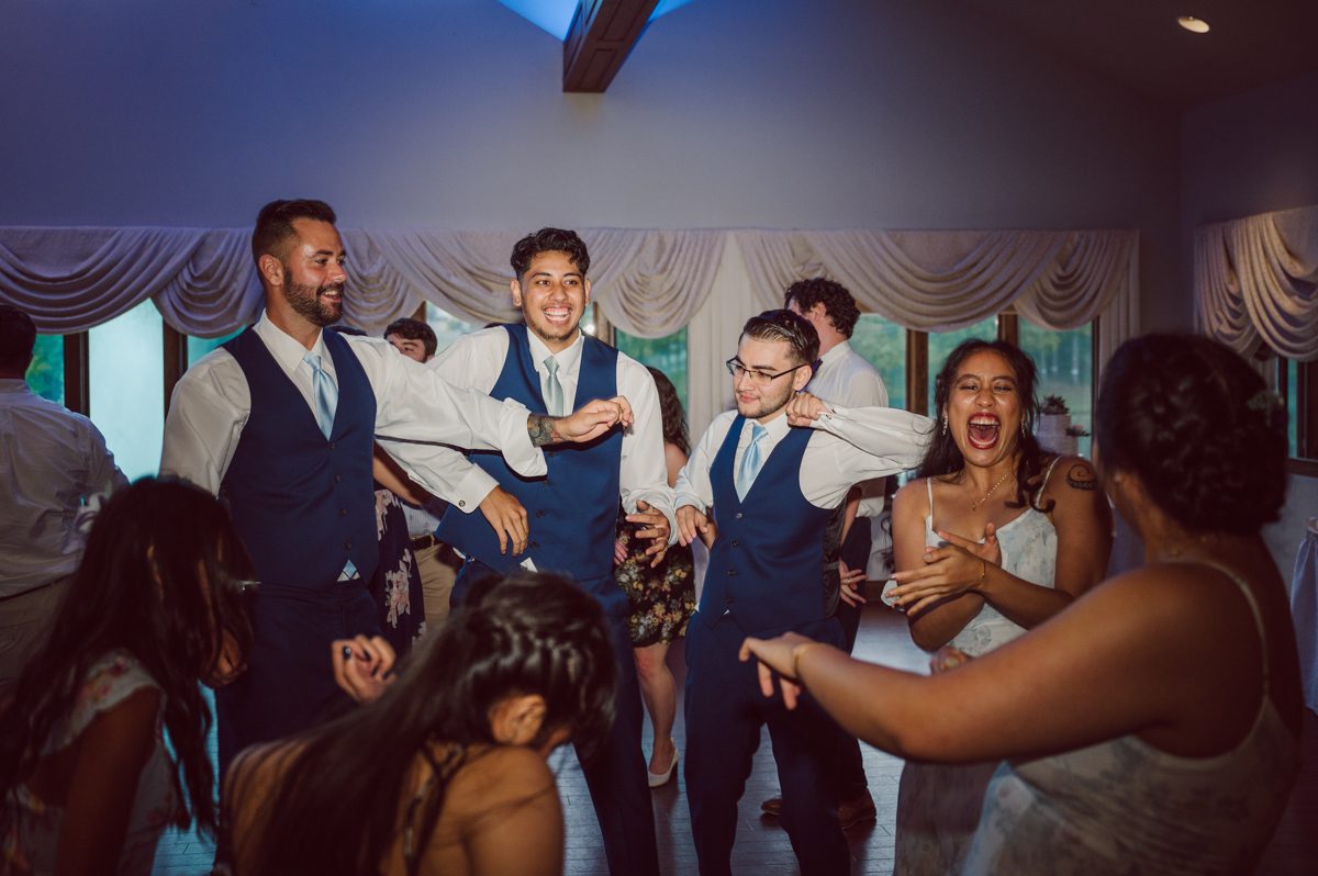 These two dancers, passionate lovers got married on a hot humid day at Auletto Caterers in Deptford NJ. Even though it was hot & humid Nina and Hector were all smiles as well as their family during the family portrait time. Wedding couple's and families that listens to you and does everything you ask them to even though the weather and environment can be tough are the BEST kind of clients! Nina and Hector were that best ideal clients, they from day one left all control regarding photo to me, did not question or have concerns. Knowing that you have this full trust and control on the wedding day makes you want to give your 100% and more. Nina and Hector are one of my top ideal clients and their wedding day photos are living proof of it. Nina and Hector's wedding day was combined of casual, mess, chaos, laughters, chill, emotional and passionate love for dancing. This was my first time at Auletto Caterers and in this part of NJ and this wedding venue in Deptford NJ was a pleasant surprise. It was full of secret locations for photos, garden, little pond where I played around with reflections, peacocks, waterfall and lavender field! Plus kind people to work with. Nina and Hector's July wedding at Auletto Caterers NJ captured by Karis from Hey Karis NY, NJ, Brooklyn, Hudson Valley and Catskills Wedding and Elopement Photographer.