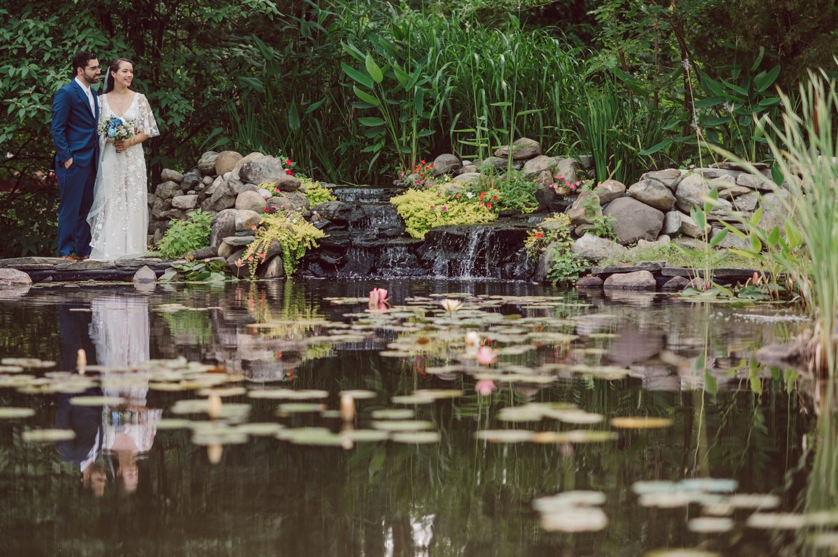 These two dancers, passionate lovers got married on a hot humid day at Auletto Caterers in Deptford NJ. Even though it was hot & humid Nina and Hector were all smiles as well as their family during the family portrait time. Wedding couple's and families that listens to you and does everything you ask them to even though the weather and environment can be tough are the BEST kind of clients! Nina and Hector were that best ideal clients, they from day one left all control regarding photo to me, did not question or have concerns. Knowing that you have this full trust and control on the wedding day makes you want to give your 100% and more. Nina and Hector are one of my top ideal clients and their wedding day photos are living proof of it. Nina and Hector's wedding day was combined of casual, mess, chaos, laughters, chill, emotional and passionate love for dancing. This was my first time at Auletto Caterers and in this part of NJ and this wedding venue in Deptford NJ was a pleasant surprise. It was full of secret locations for photos, garden, little pond where I played around with reflections, peacocks, waterfall and lavender field! Plus kind people to work with. Nina and Hector's July wedding at Auletto Caterers NJ captured by Karis from Hey Karis NY, NJ, Brooklyn, Hudson Valley and Catskills Wedding and Elopement Photographer.